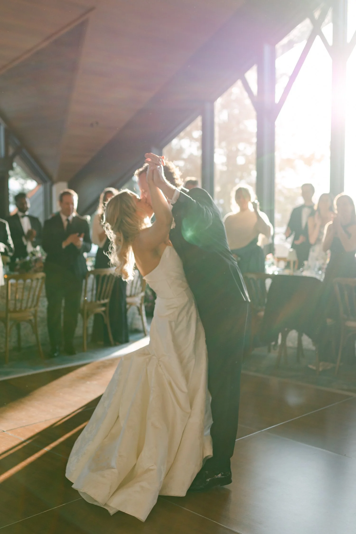 Edgewood maximalist wedding, photo of the newlyweds sharing their first dance at their indoor wedding reception
