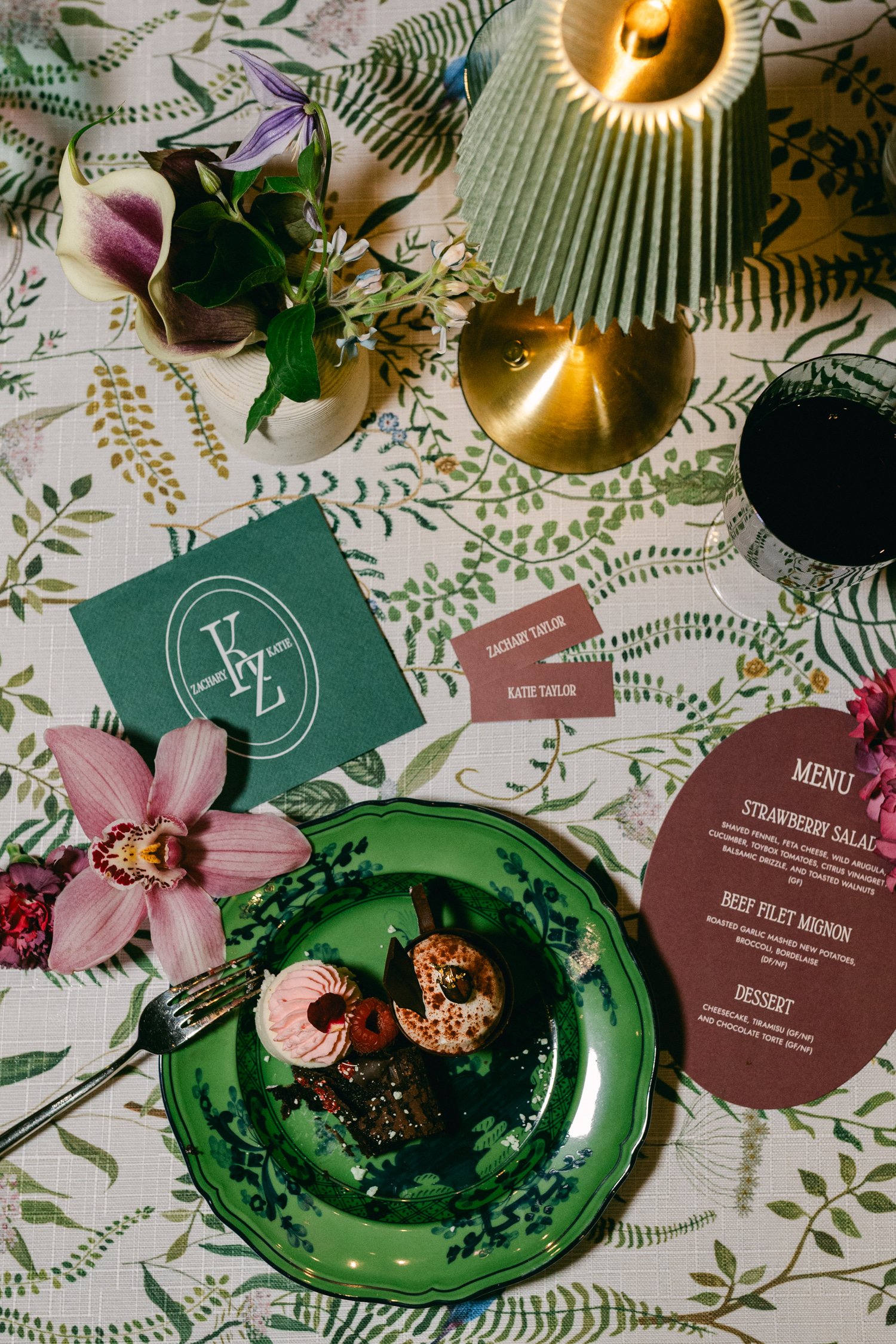 Edgewood maximalist wedding, photo of reception details with vibrant green decorative plate with intricate dark green patterns