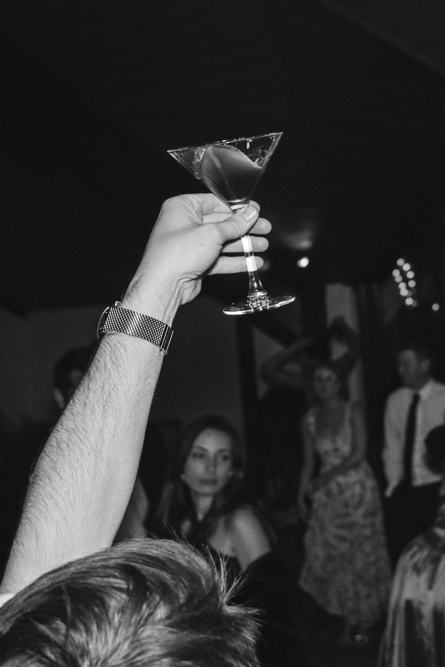 Edgewood maximalist wedding, photo of the guest enjoying the celebration holding a martini glass