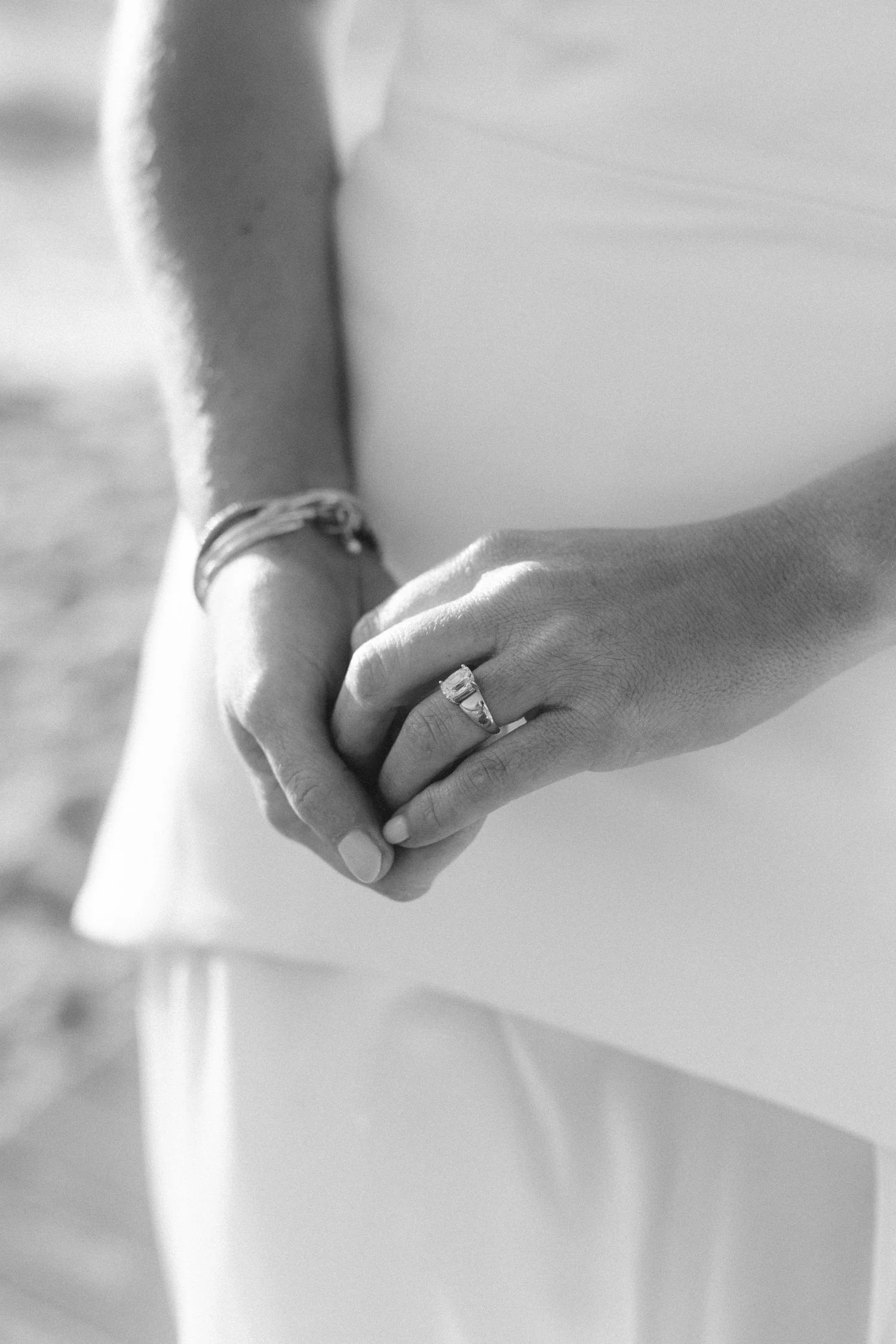 Riva Grill welcome party, photo of the bride wearing her classic emerald-cut engagement ring