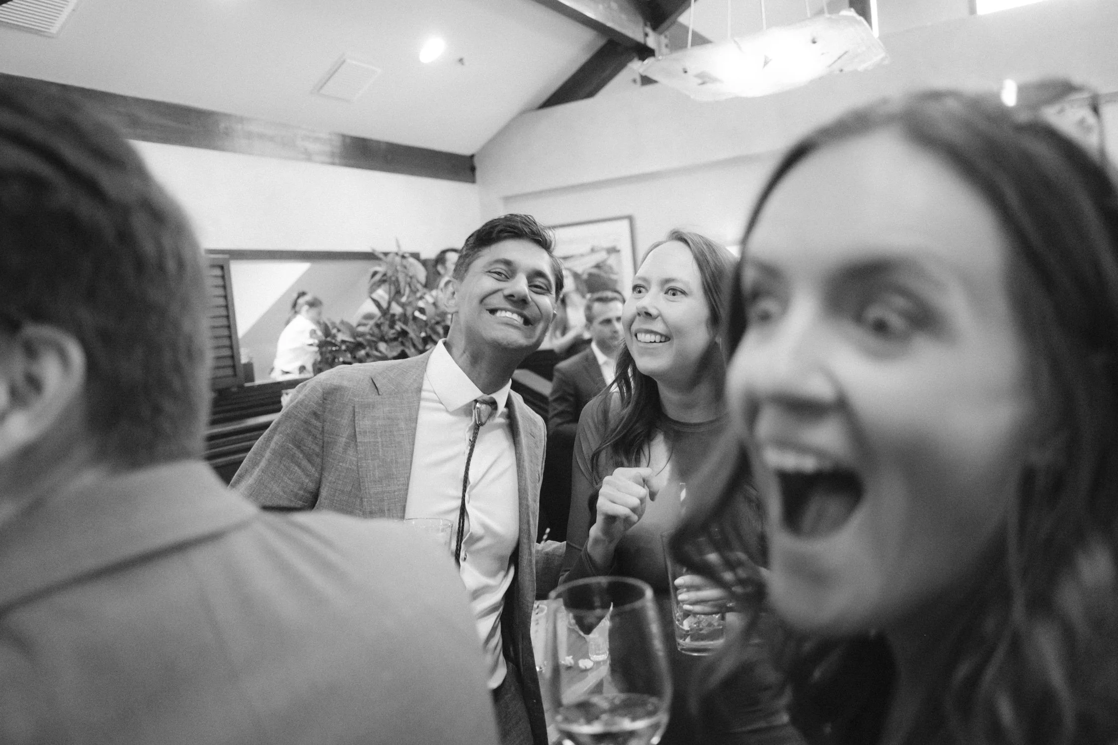 Riva Grill welcome party, photo of the guests smiling and laughing during the welcome party