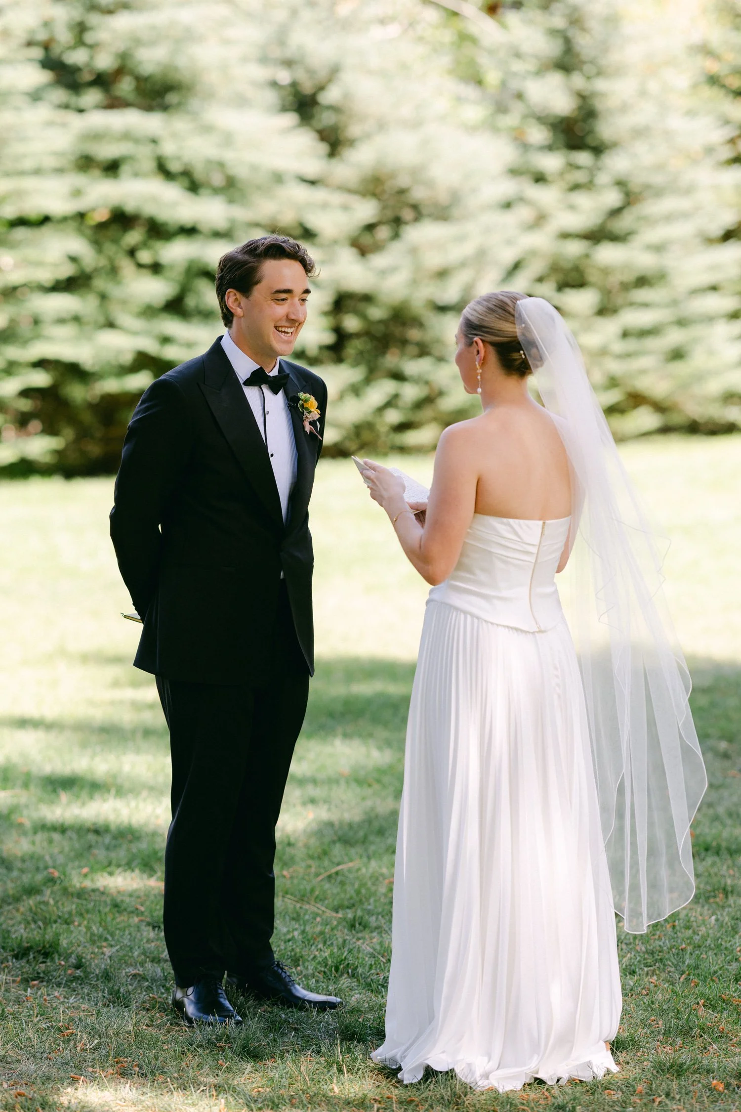 Lake Tahoe 4-H Camp wedding photos, photo of the bride and groom exchanging private vows outdoors in a garden setting