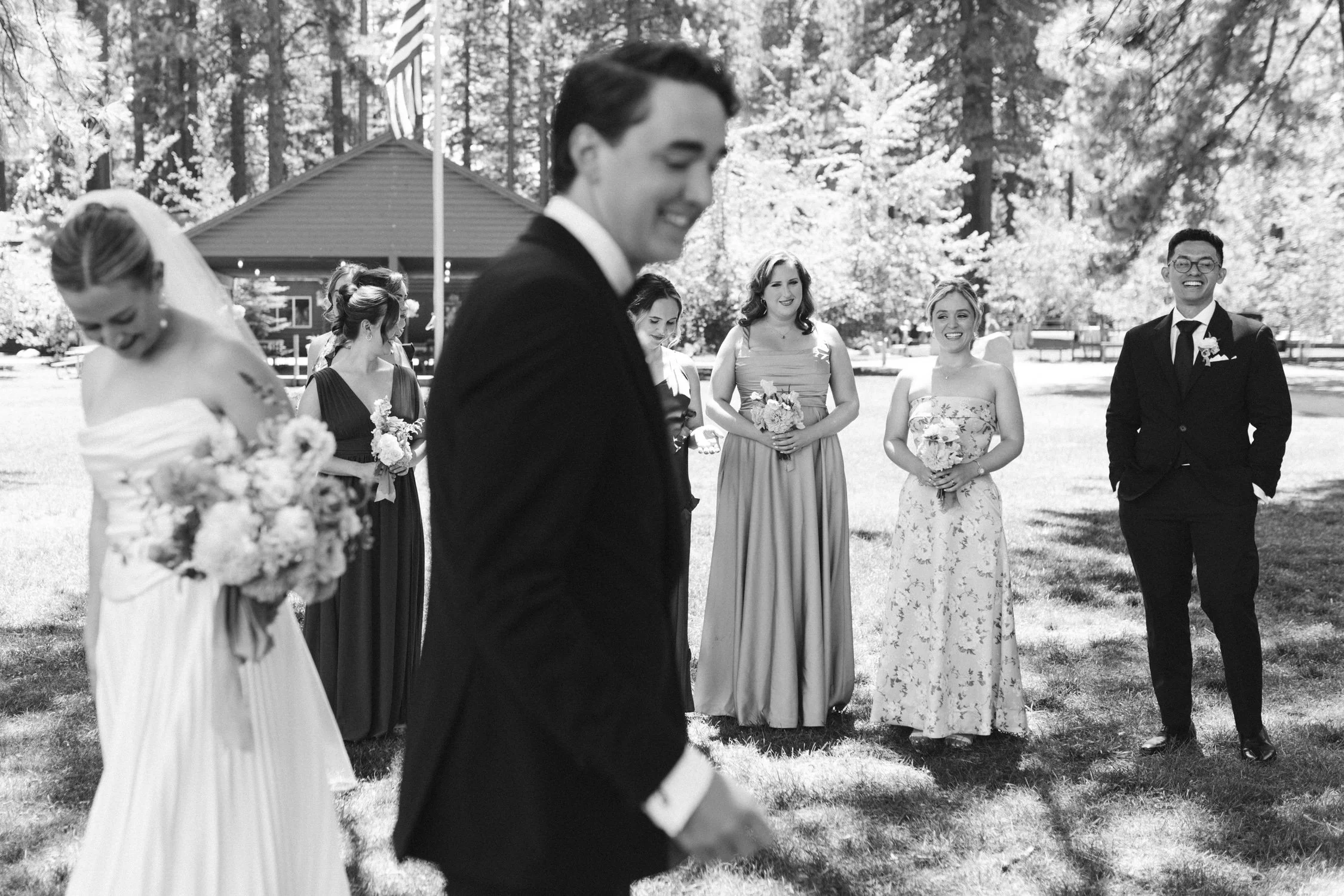 Lake Tahoe 4-H Camp wedding photos, photo of the bride and groom together with their wedding party outdoors surrounded by trees