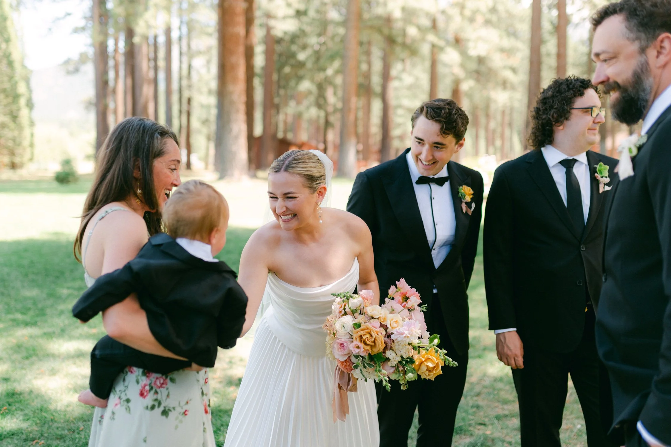 Lake Tahoe 4-H Camp wedding photos, photo of a candid, joyful scene from a wedding held in a forest setting