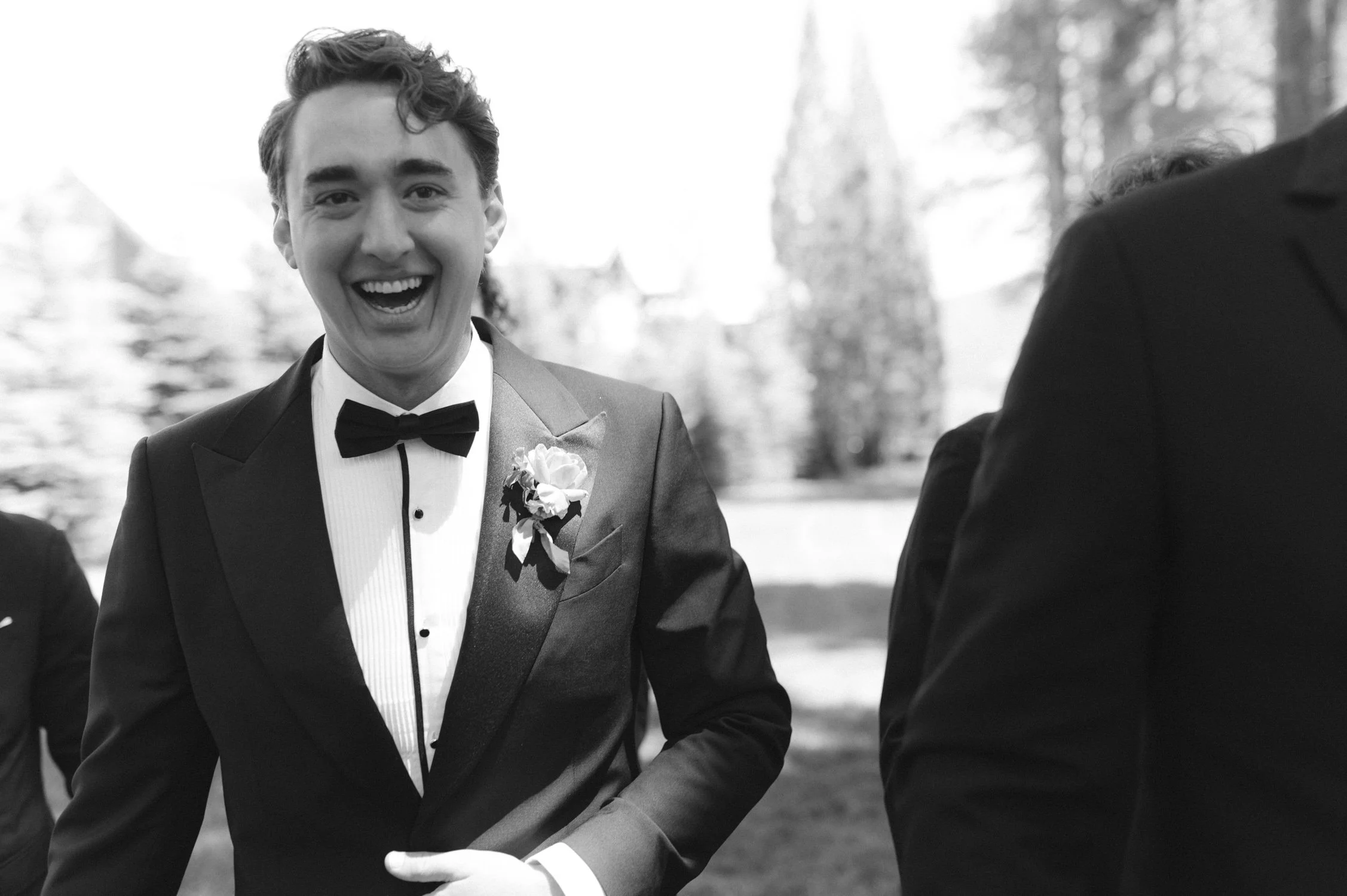 Lake Tahoe 4-H Camp wedding photos, photo of the groom sharing a joyful moment with his groomsmen