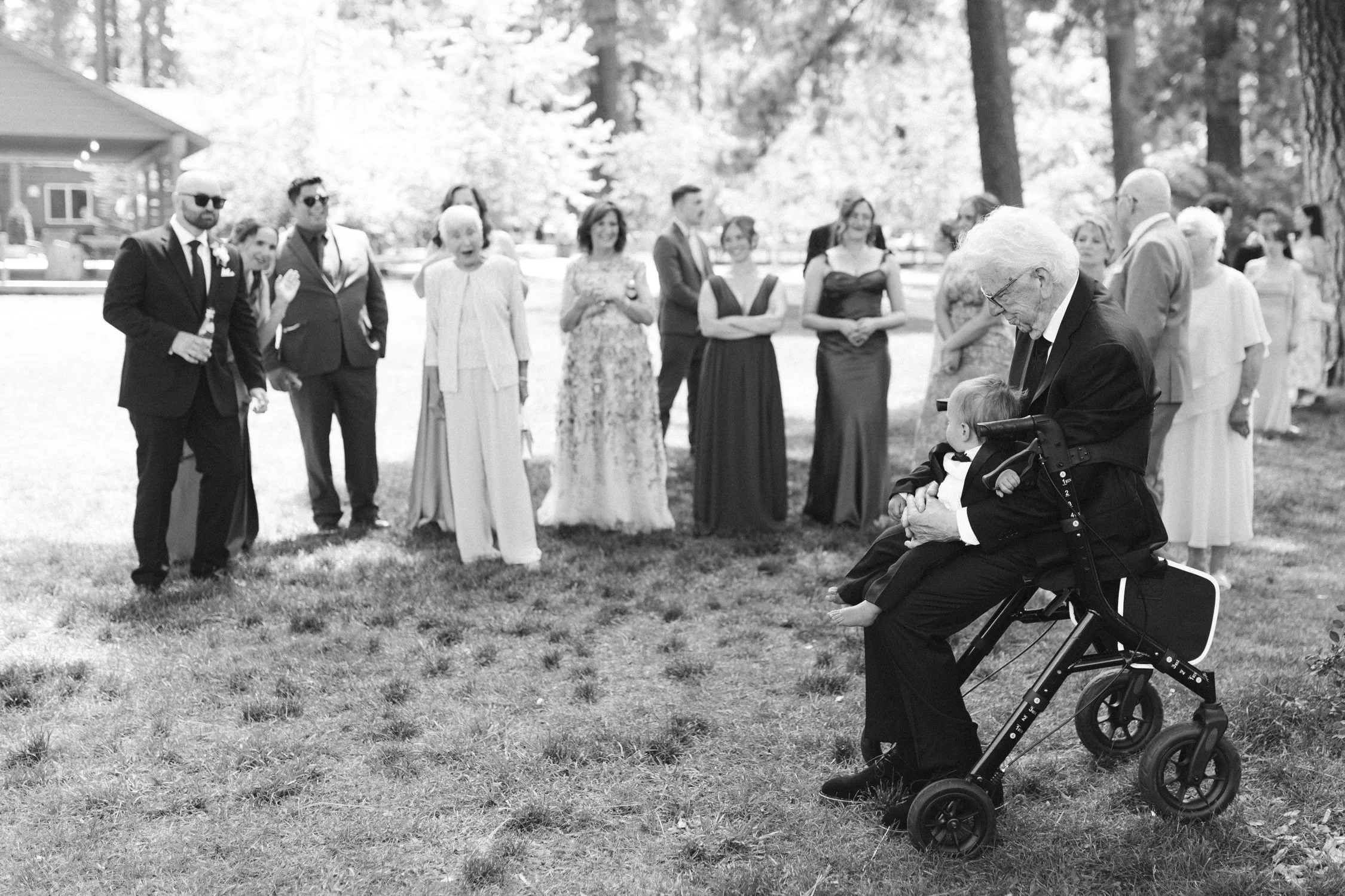Lake Tahoe 4-H Camp wedding photos, photo of a black and white portrait from a wedding taking place on a sunny, grassy lawn
