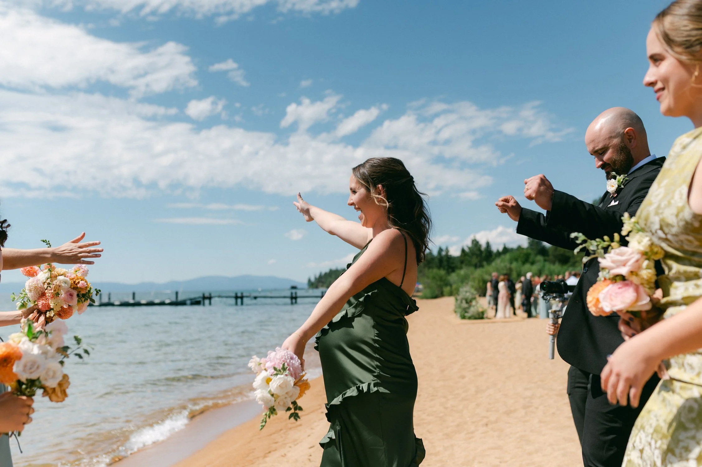 Lake Tahoe 4-H Camp wedding photos, photo of a lively moment from a lakeside wedding celebration