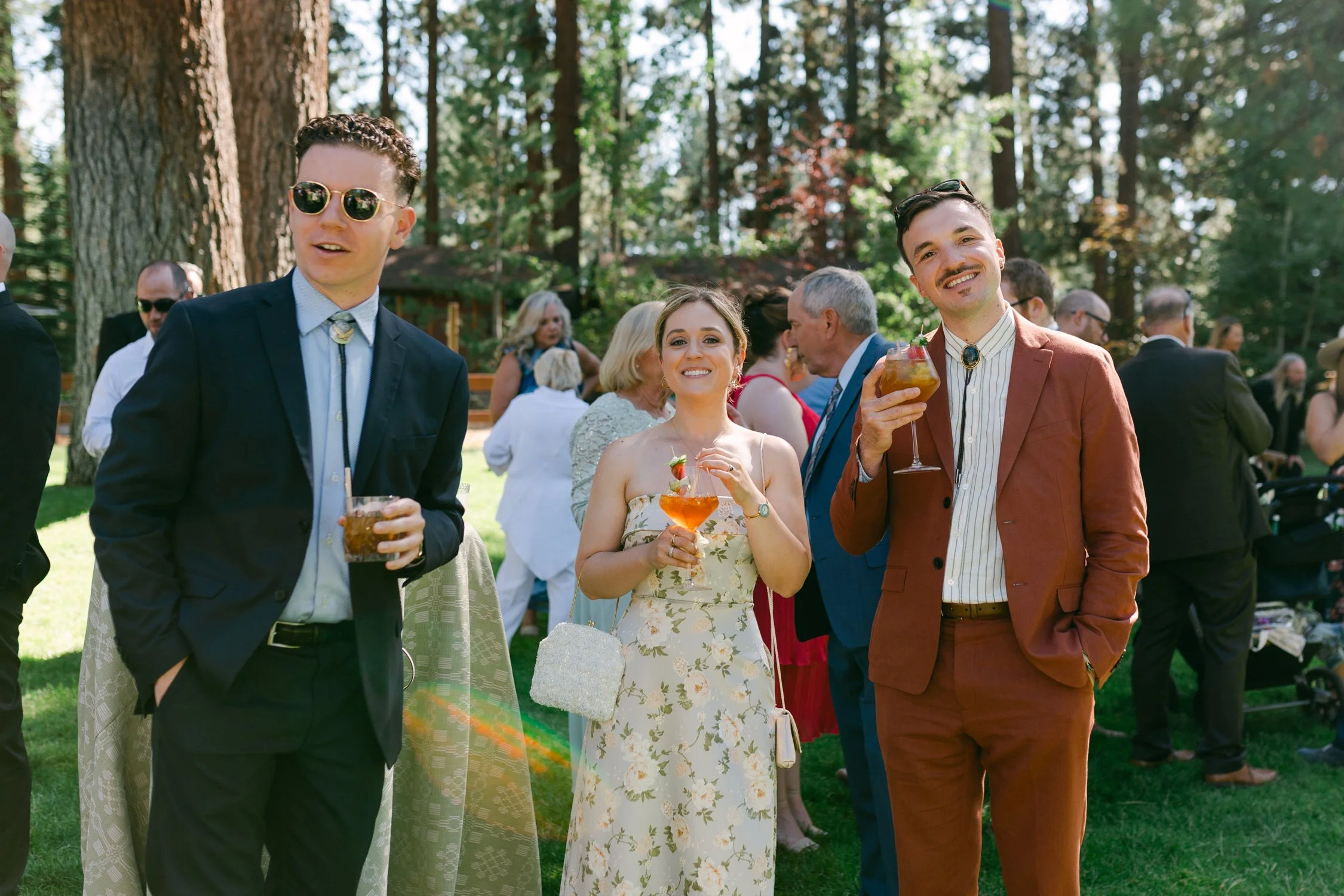Lake Tahoe 4-H Camp wedding photos, photo of the wedding guests enjoying drinks at an outdoor wedding