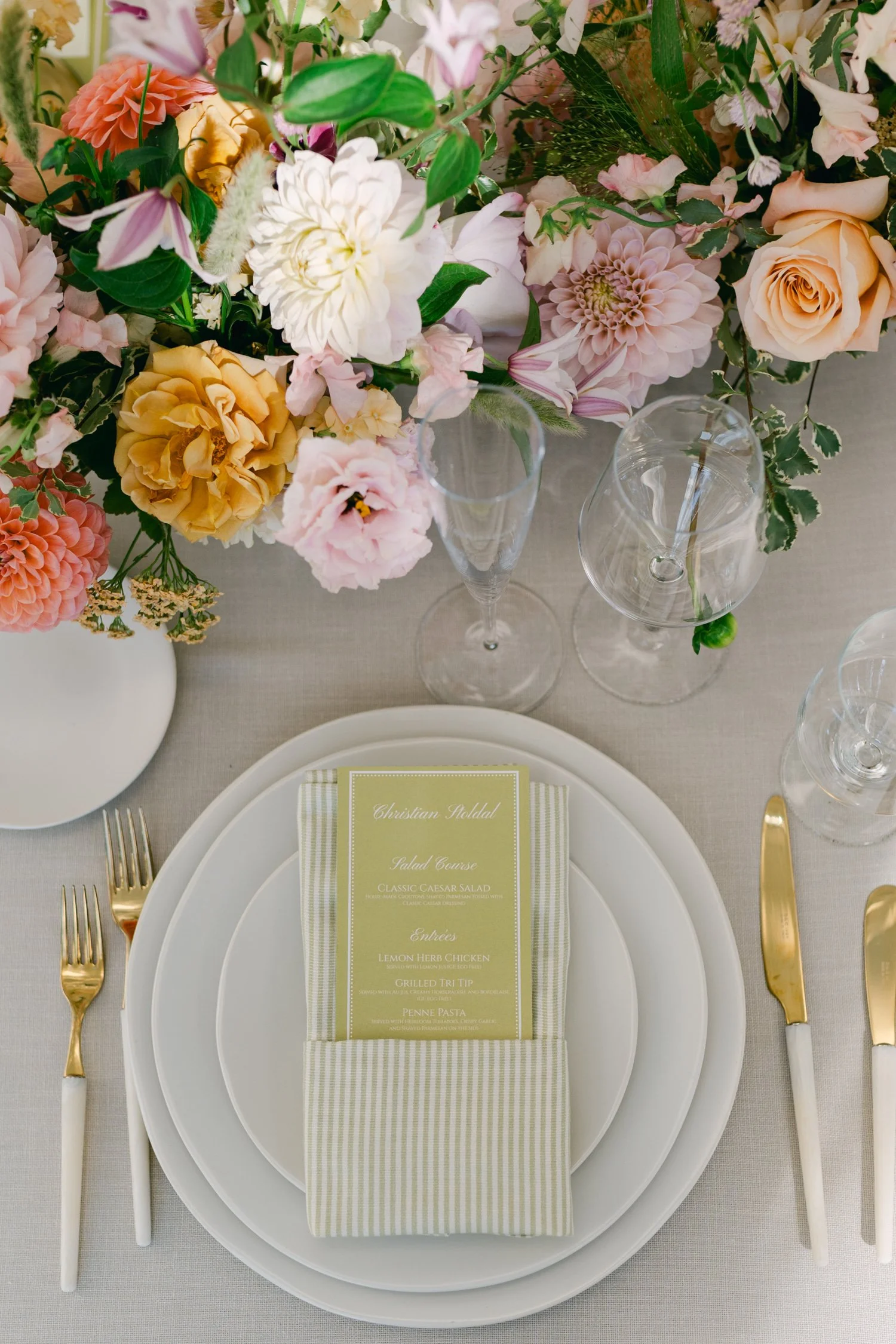 Lake Tahoe 4-H Camp wedding photos, photo of an elegant dinner reception tablescape features soft, textured linens and a romantic floral arrangement designed
