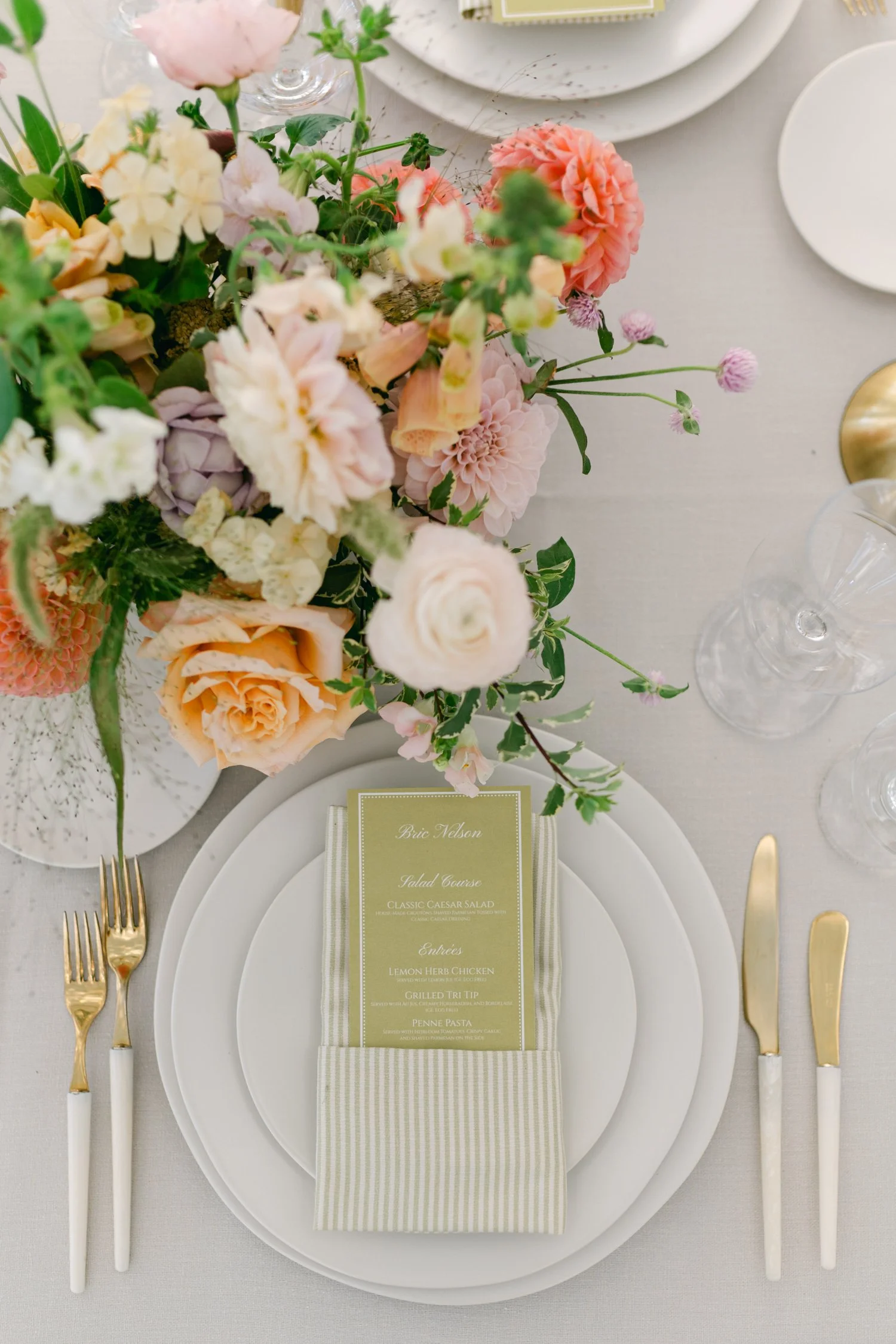 Lake Tahoe 4-H Camp wedding photos, photo of wedding reception tablescape featuring soft, textured linens and lush, garden-inspired florals in pastel shades