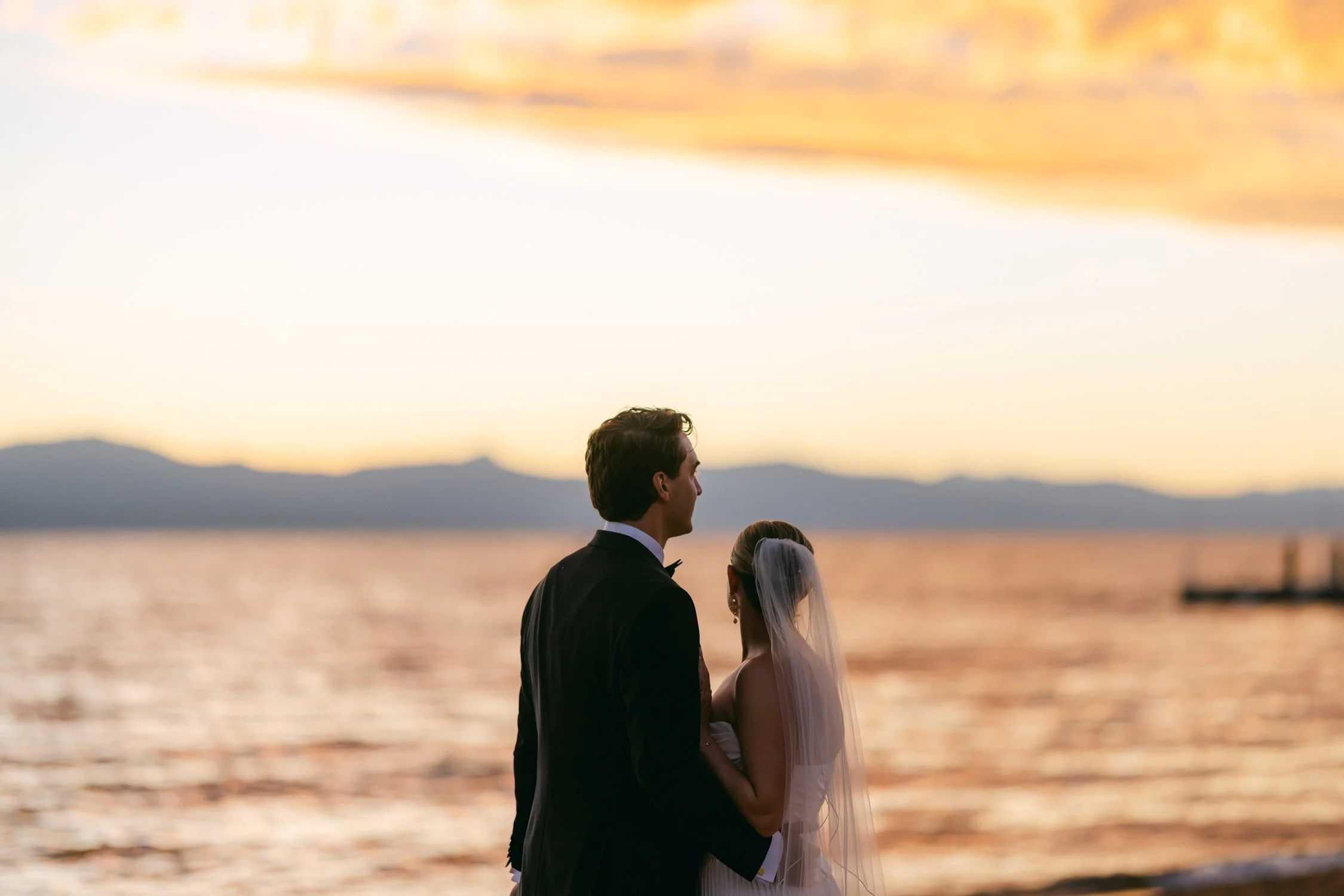 Lake Tahoe 4-H Camp wedding photos, photo of stunning sunset portraits taking place on the shores of Lake Tahoe.