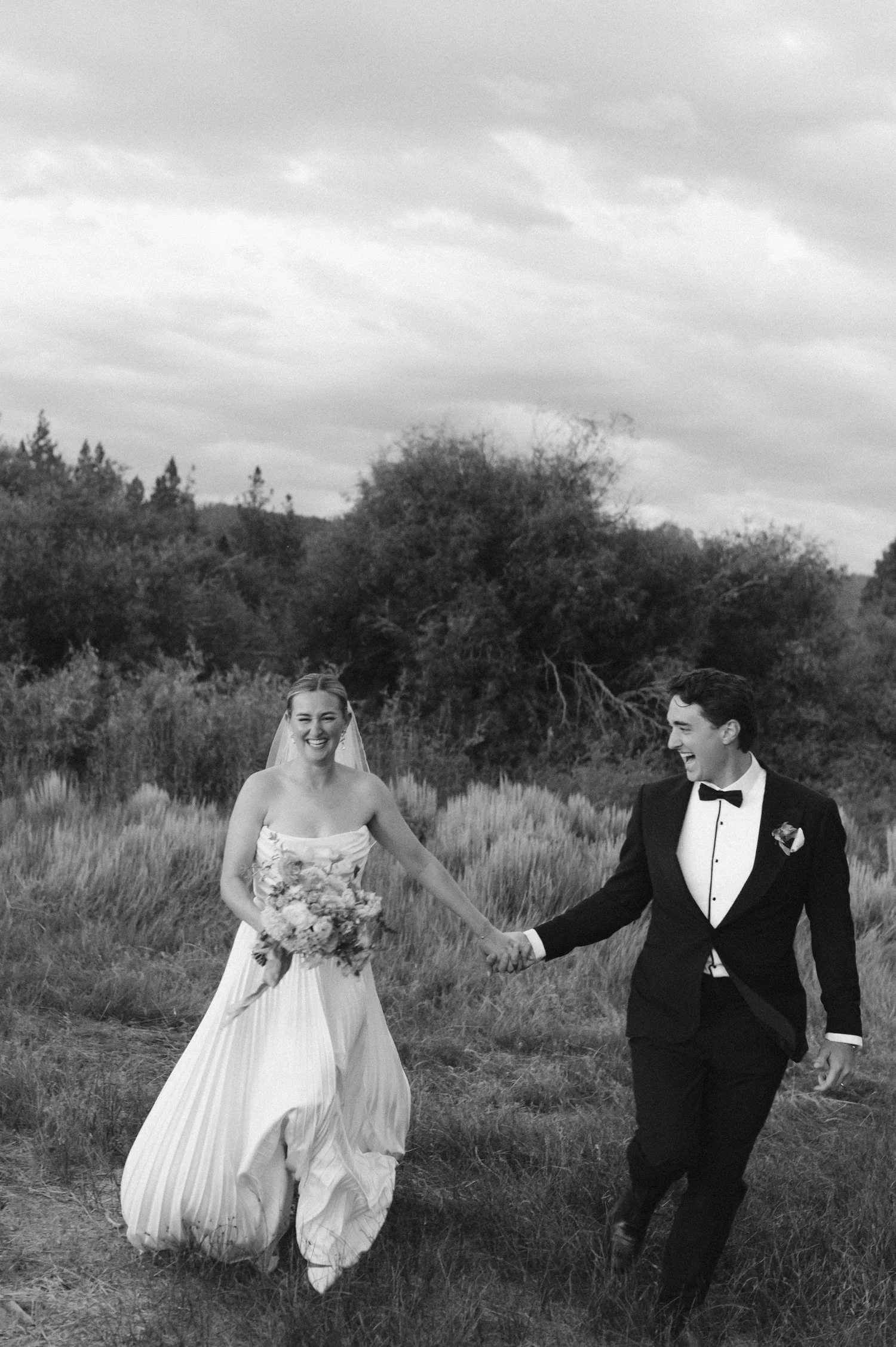 Lake Tahoe 4-H Camp wedding photos, photo of the newlywed couple joyfully walking together outdoors