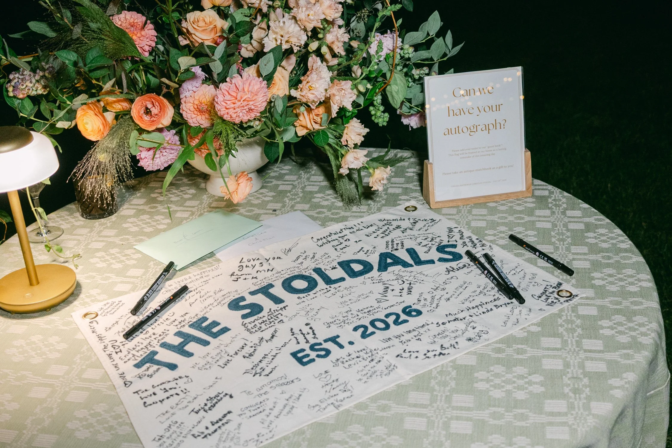 Lake Tahoe 4-H Camp wedding photos, photo of a custom embroidered banner as a unique wedding guest book alternative.