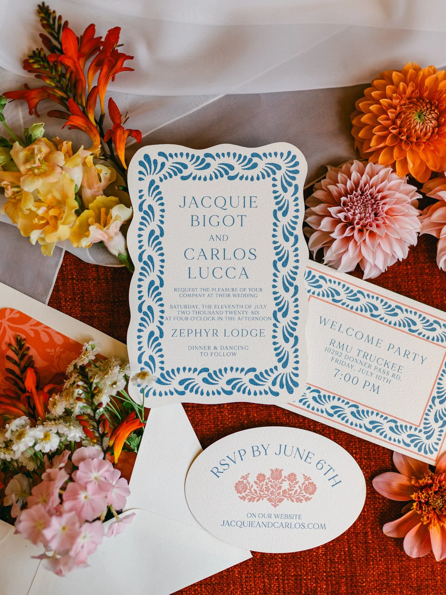 Zephyr Lodge wedding, photo of Spanish Mission-style wedding invitations with blue-and-white Talavera tiles, arched shapes, terracotta accents, and delicate laser-cut papel picado patterns.