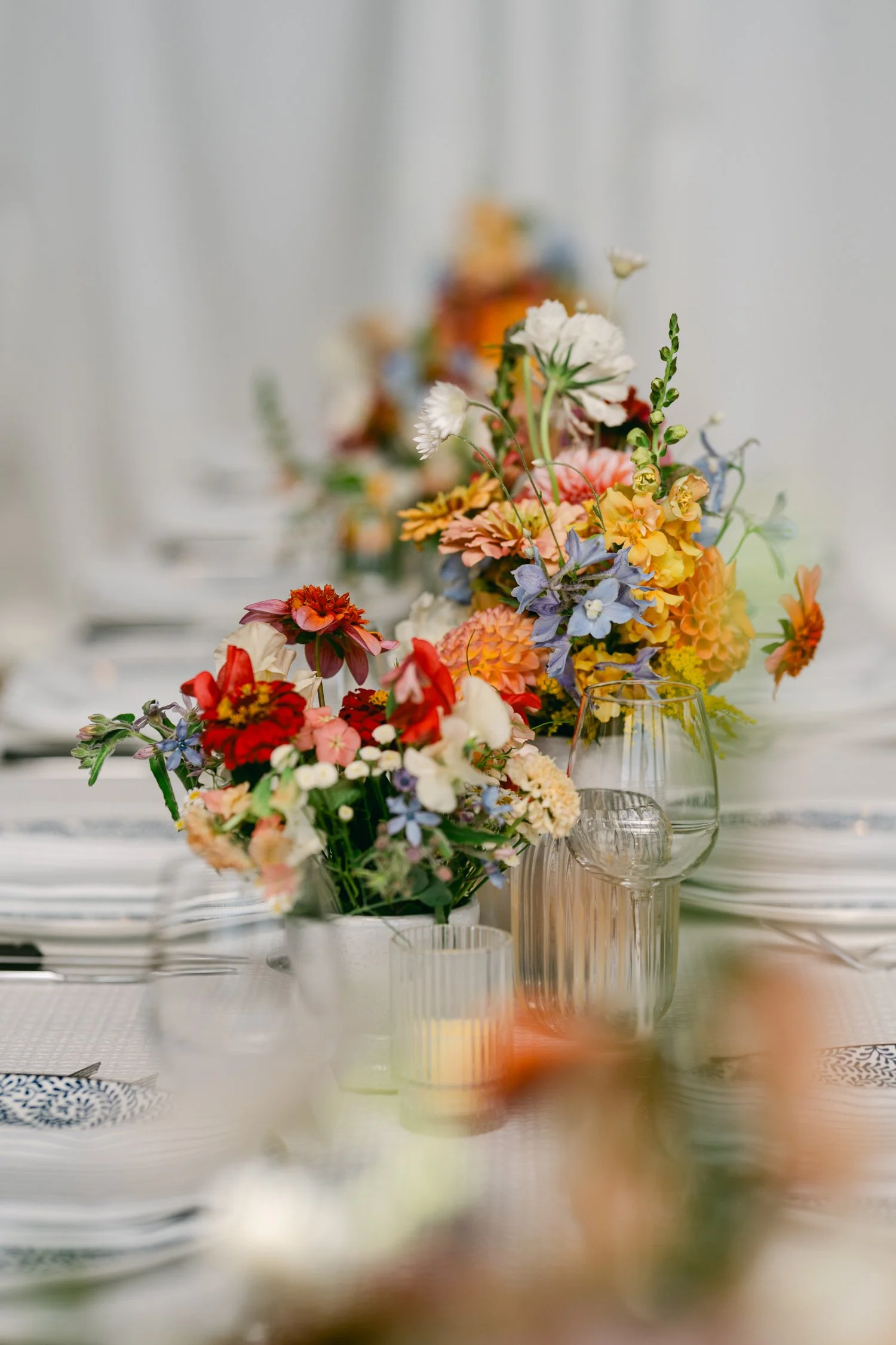 Zephyr Lodge wedding, photo of colorful floral centerpieces featuring a wildflower style with a vibrant palette 