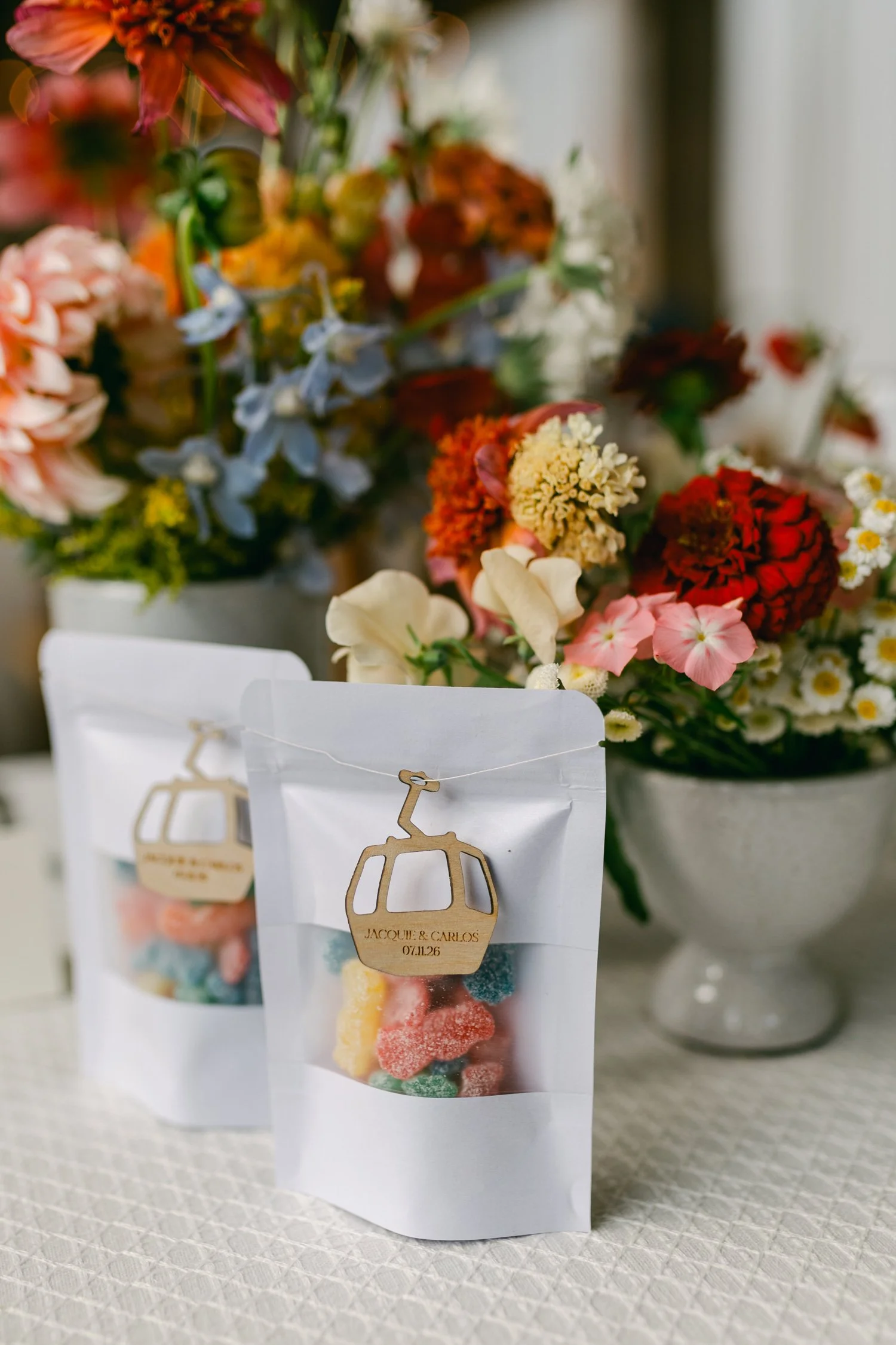 Zephyr Lodge wedding, photo of personalized white favor bags featuring a gondola-shaped tag