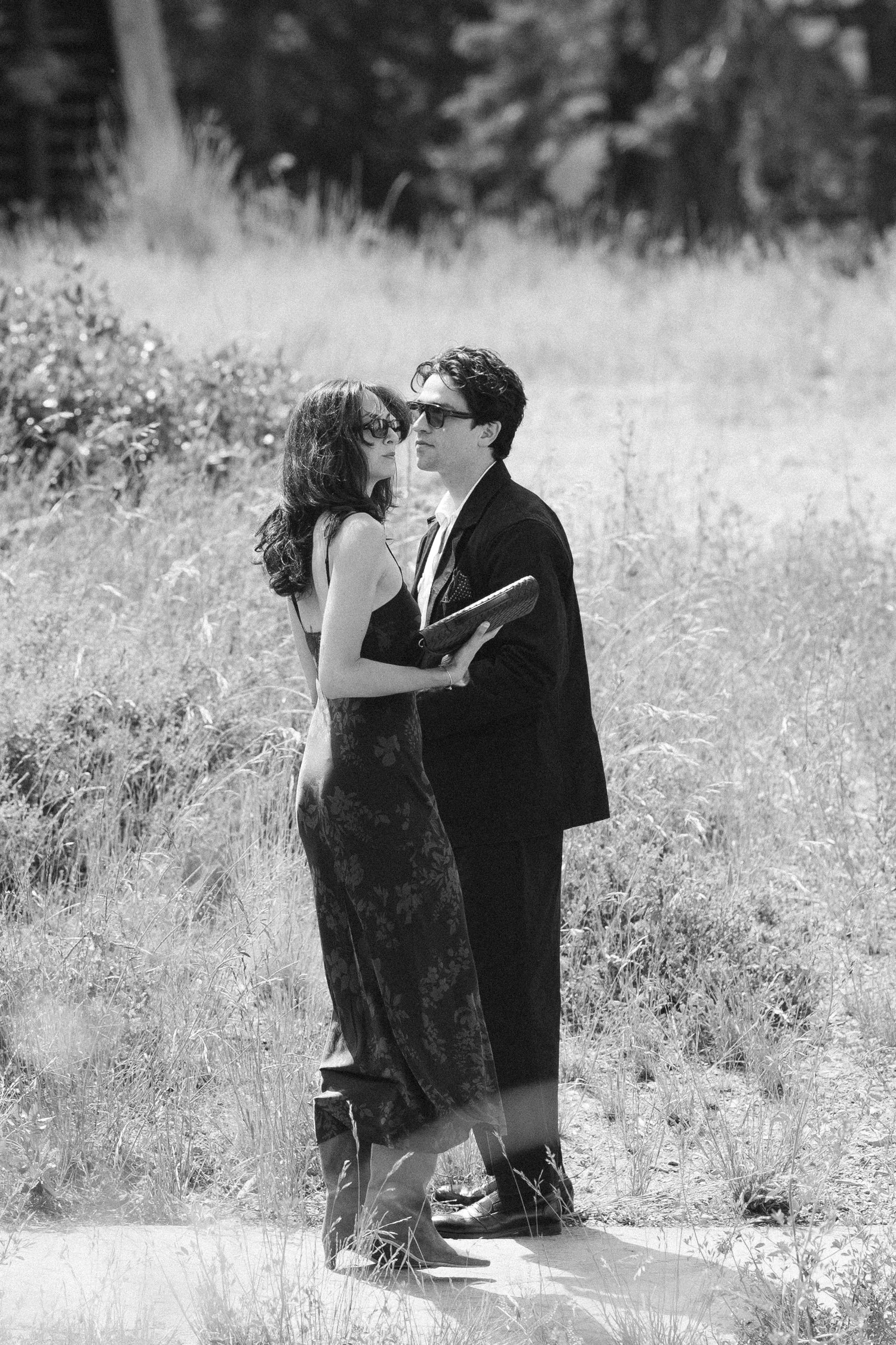 Zephyr Lodge wedding, photo of stylish wedding guests in a candid, black-and-white photograph outdoors