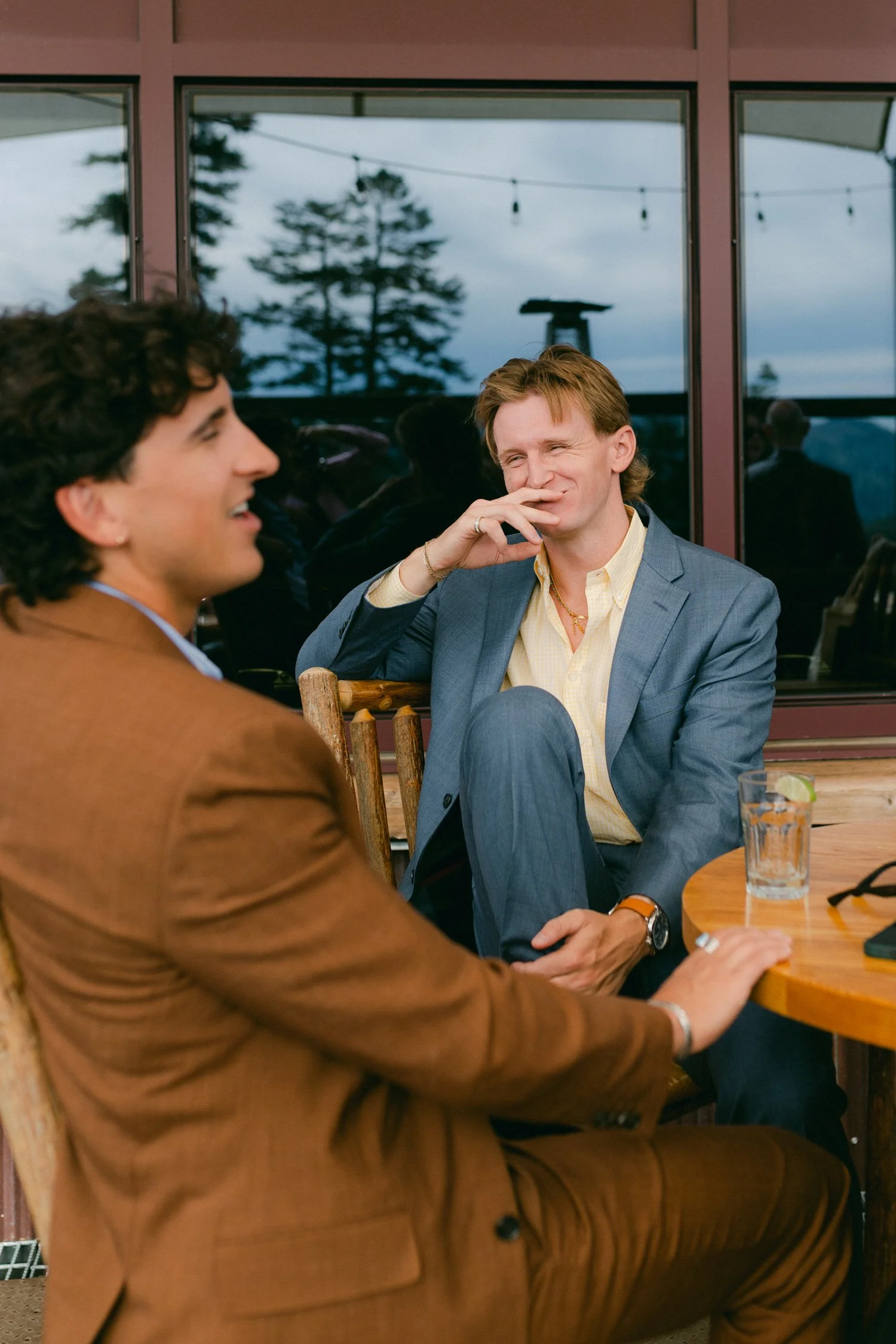 Zephyr Lodge wedding, photo of wedding guests in colorful tailored suits