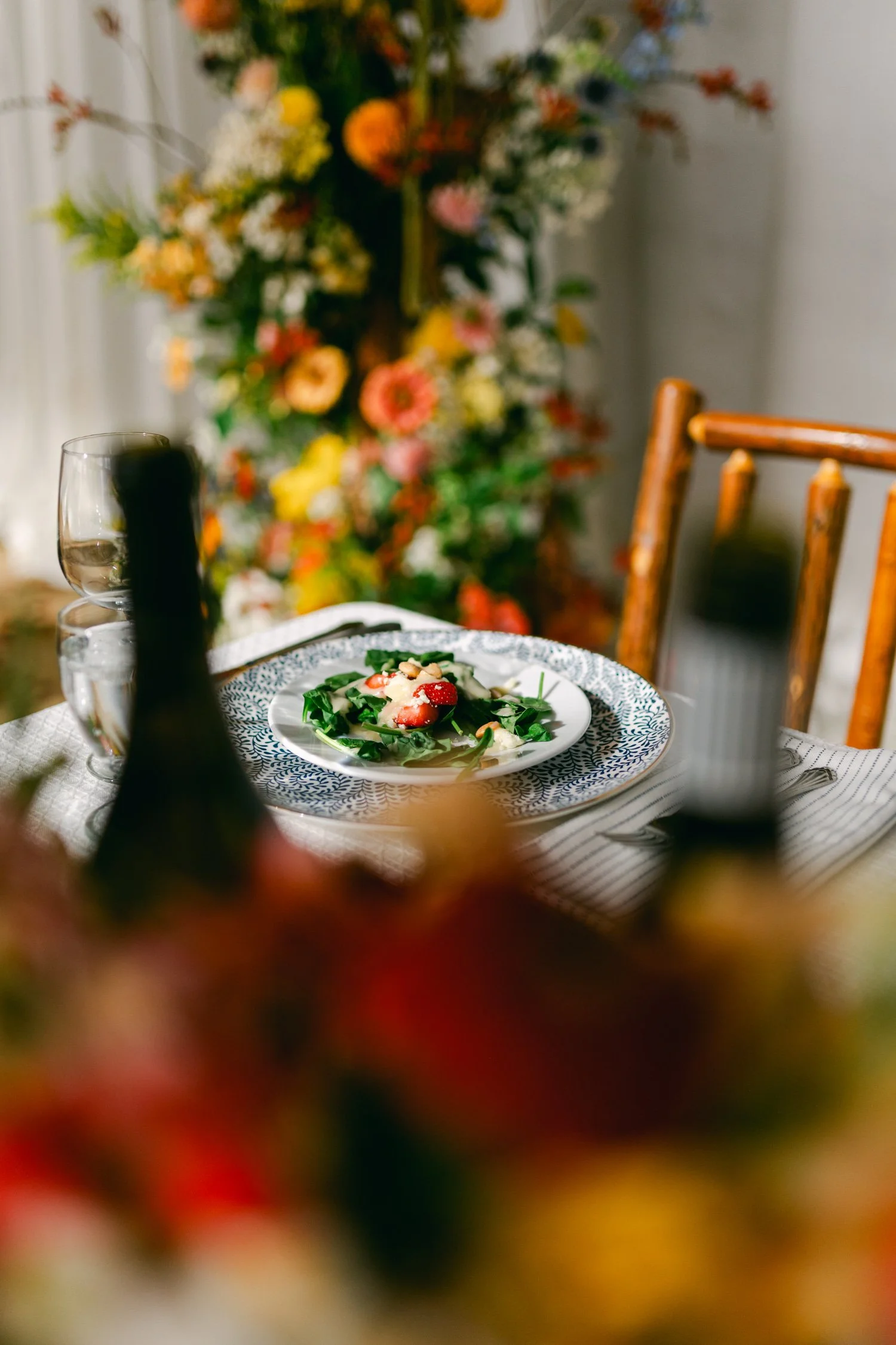 Zephyr Lodge wedding, photo of a beautifully styled table setup with a vibrant, colorful floral centerpiece 