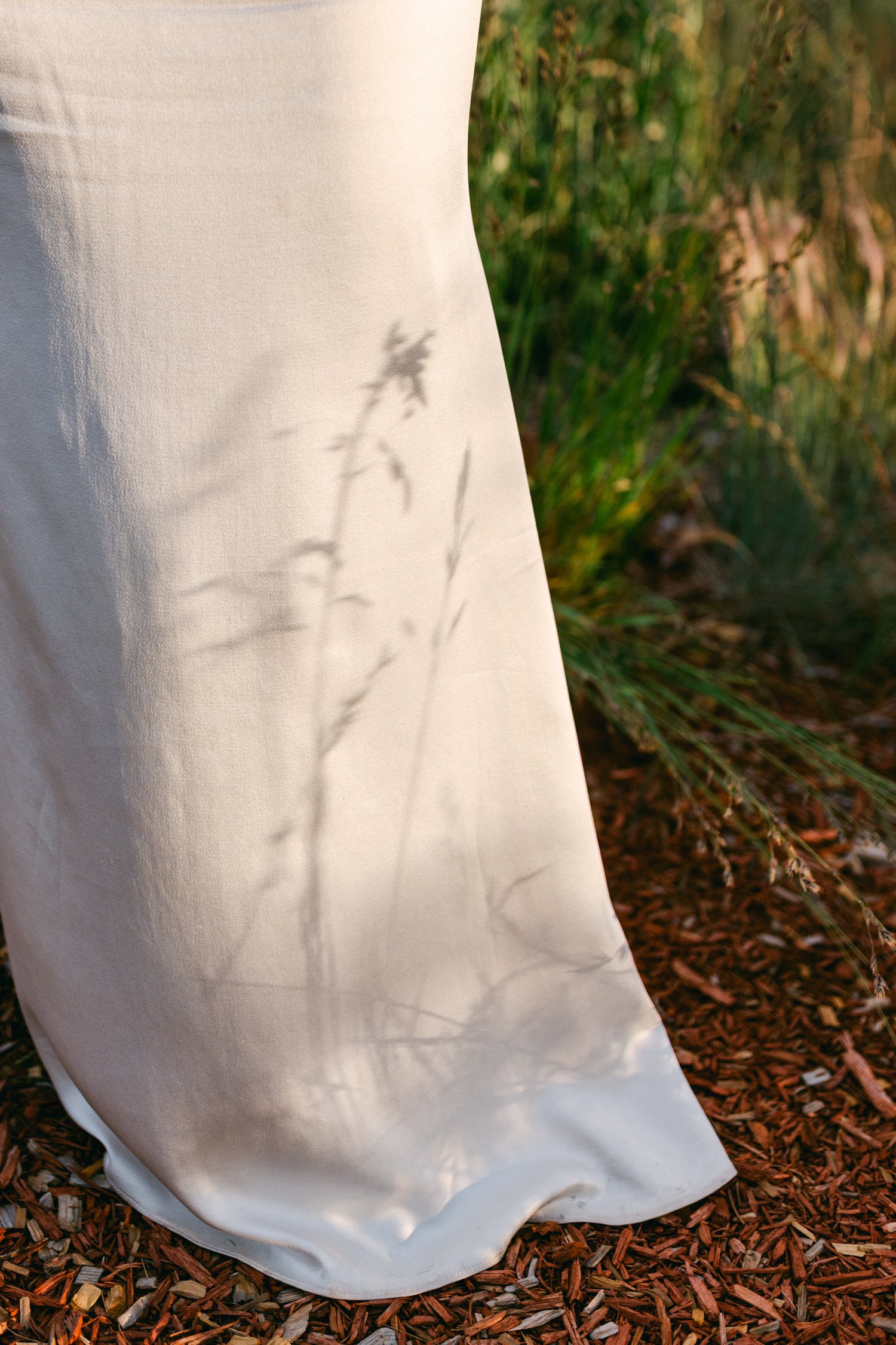 Zephyr Lodge wedding, photo of the bride in a field during golden hour