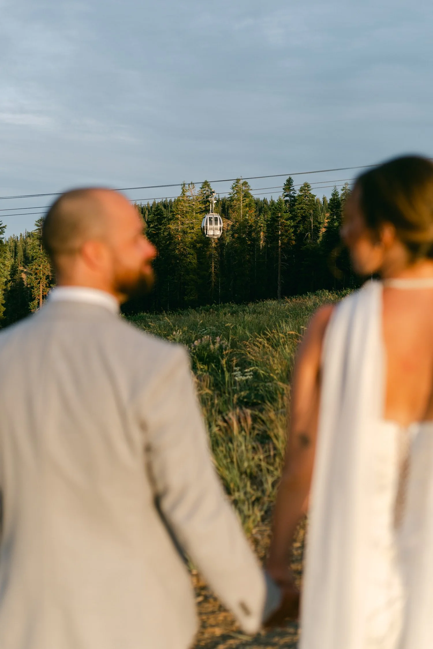 Zephyr Lodge wedding, photo of the newlywed couple overlooking a mountainous landscape 