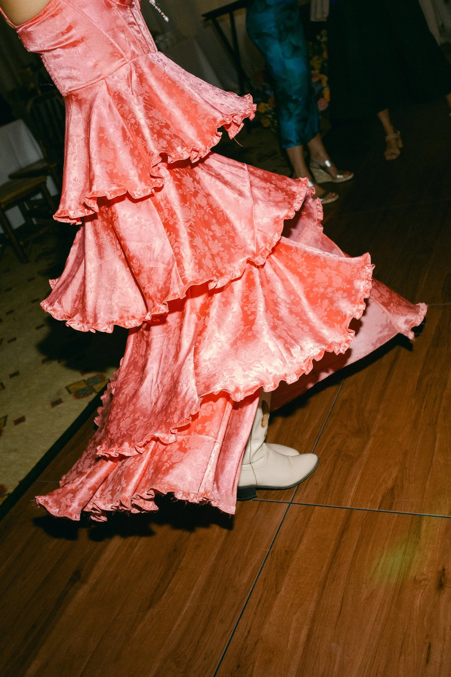 Zephyr Lodge wedding, photo of the wedding guest in a pink dress with voluminous layered ruffles