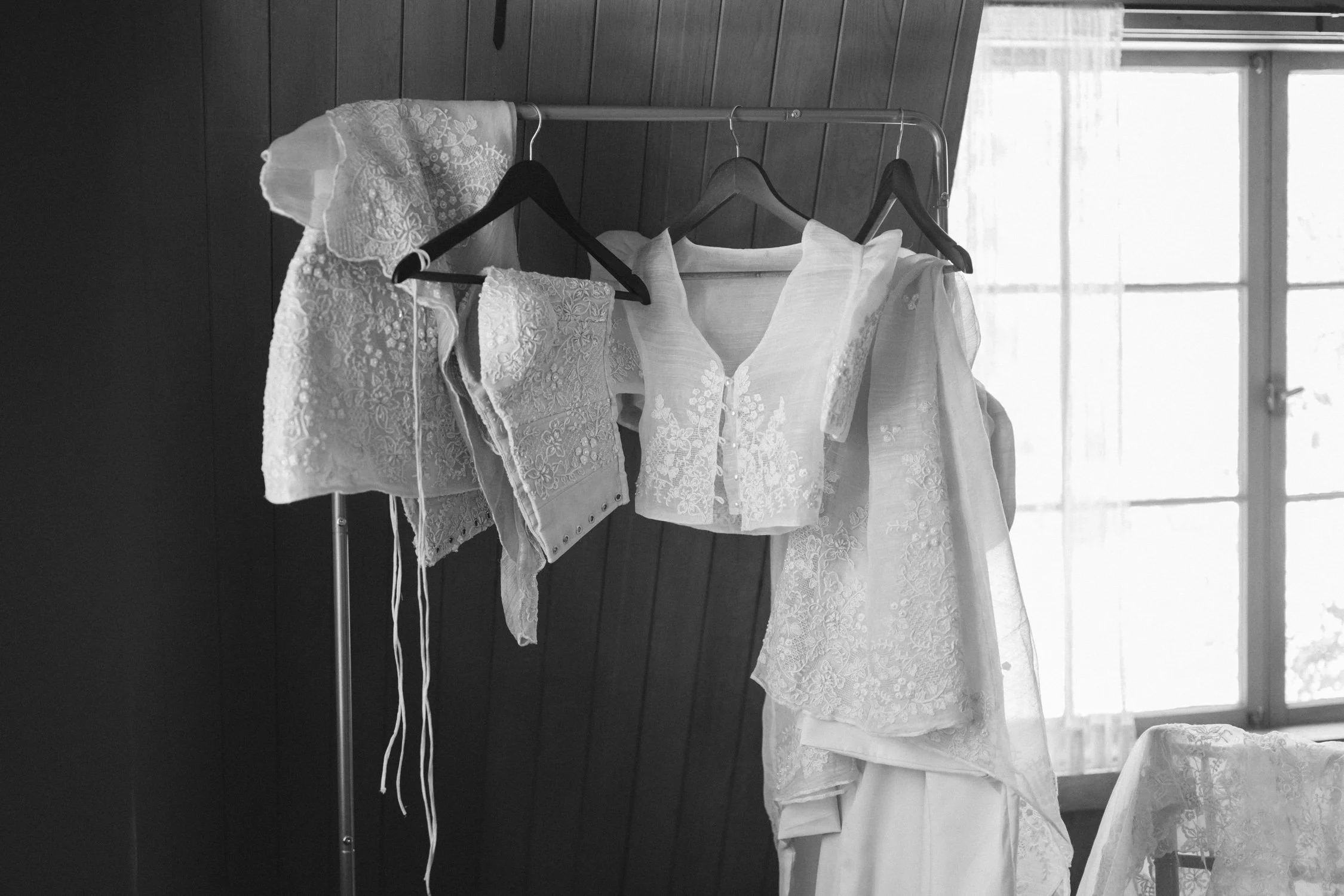A Valhalla Lake Tahoe Wedding, photo of traditional Filipino Filipiniana or barong-style wedding attire set featuring sheer, embroidered butterfly sleeves hanging on a rack.