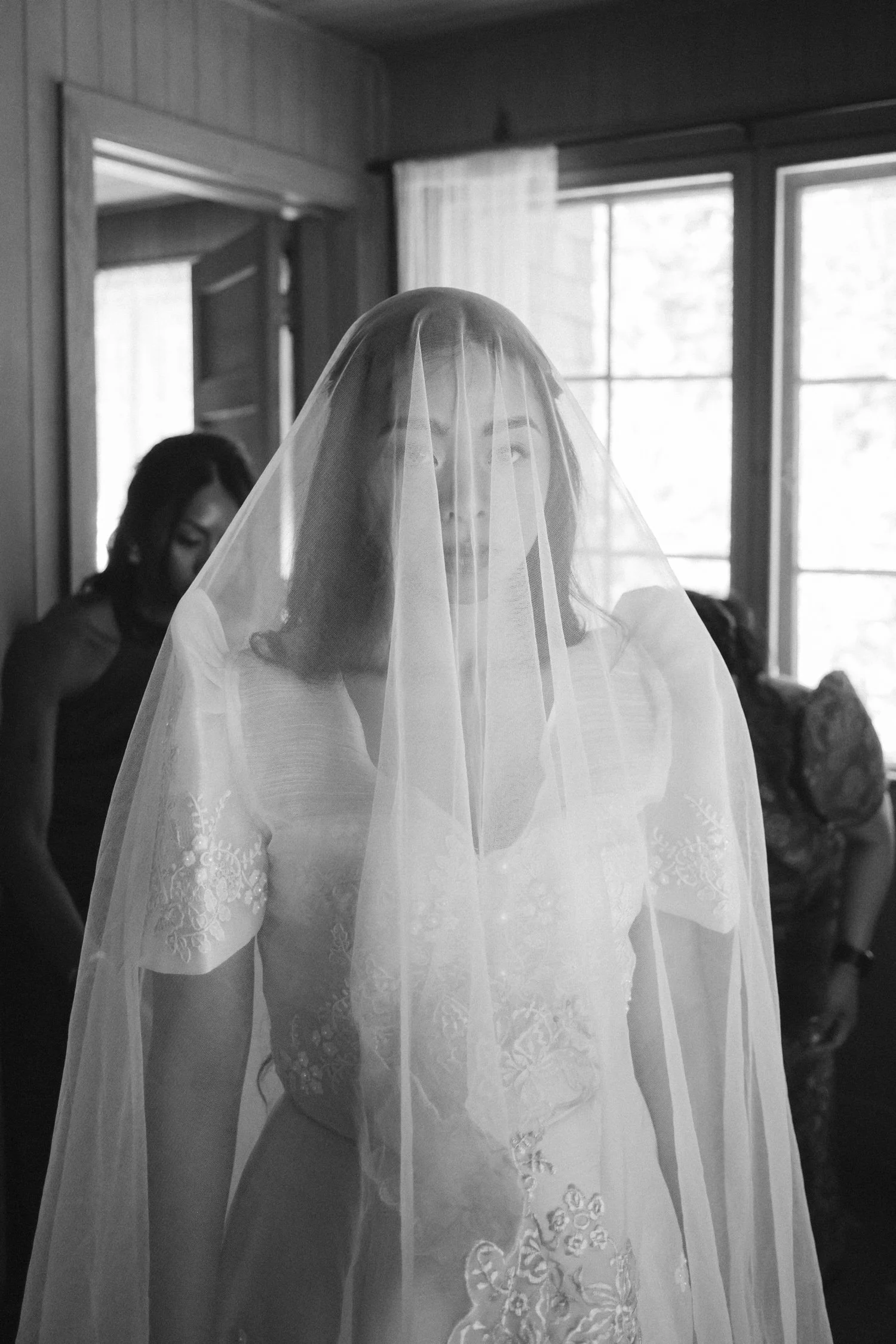 A Valhalla Lake Tahoe Wedding, photo of the bride wearing a classic Filipiniana dress featuring structured butterfly sleeves and detailed floral embroidery