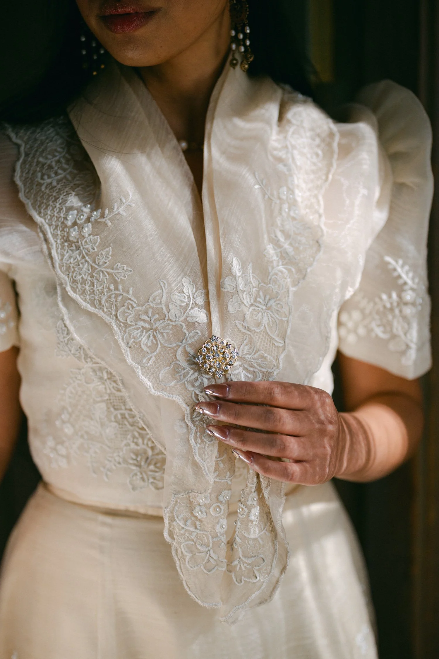 A Valhalla Lake Tahoe Wedding, photo of the bride wearing a cream-colored traditional Filipiniana dress with an embroidered pañuelo collar and butterfly sleeves.