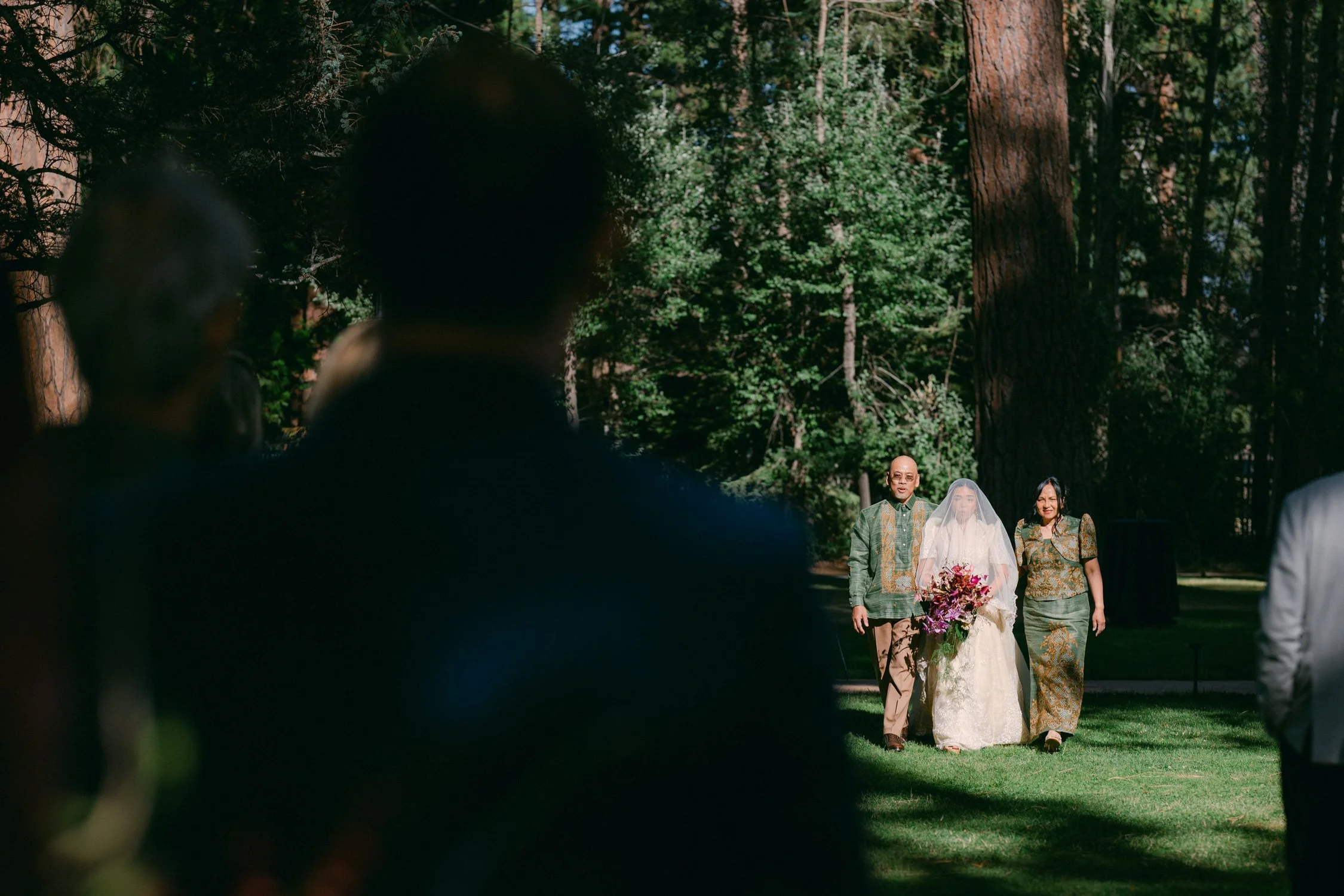A Valhalla Lake Tahoe Wedding, photo of the bride and her parents in traditional filipino attire walking down the aisle