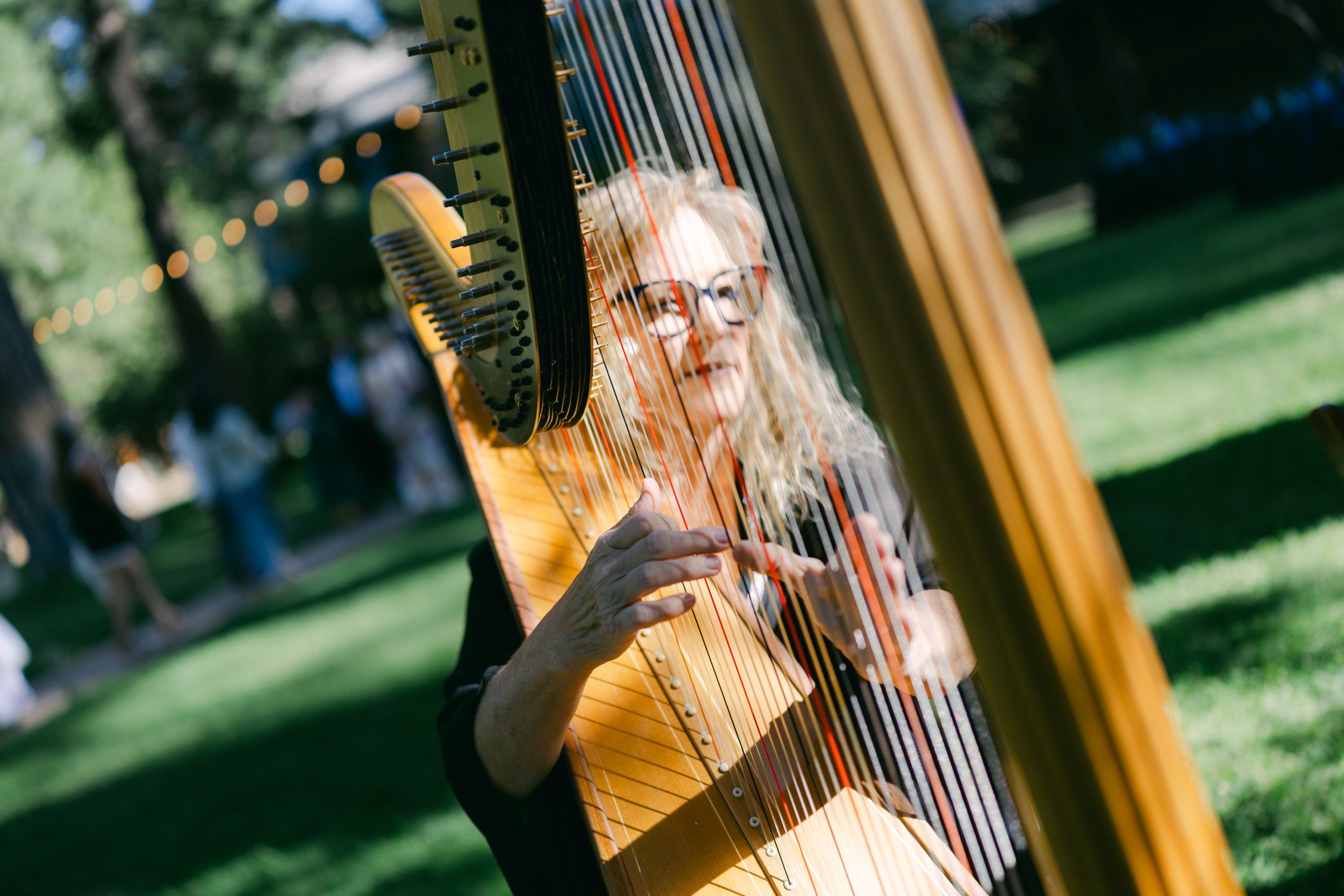 A Valhalla Lake Tahoe Wedding, photo of a pedal harp being played outdoors on a grassy lawn
