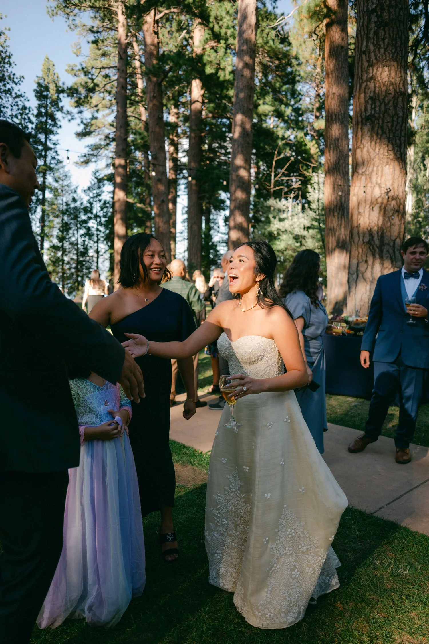A Valhalla Lake Tahoe Wedding, photo of the outdoor wedding celebration in a pine forest setting during the golden hour