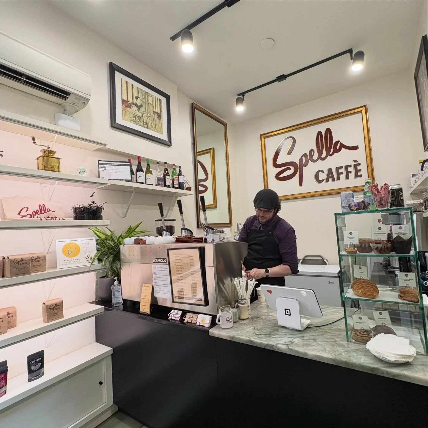 Our flagship caff&eacute; in downtown Portland embodies the spirit of Spella Caff&egrave;: a tiny, classic Italian espresso bar where craft meets connection. There, espresso is prepared in the traditional way&mdash;on a Rancilio lever machine, by han