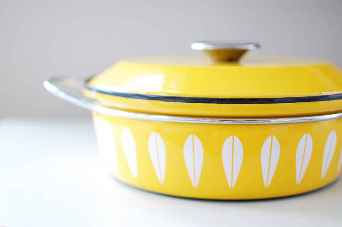 Vintage Cathrineholm kitchenware from Norway. It's all over Ebay and my stove.