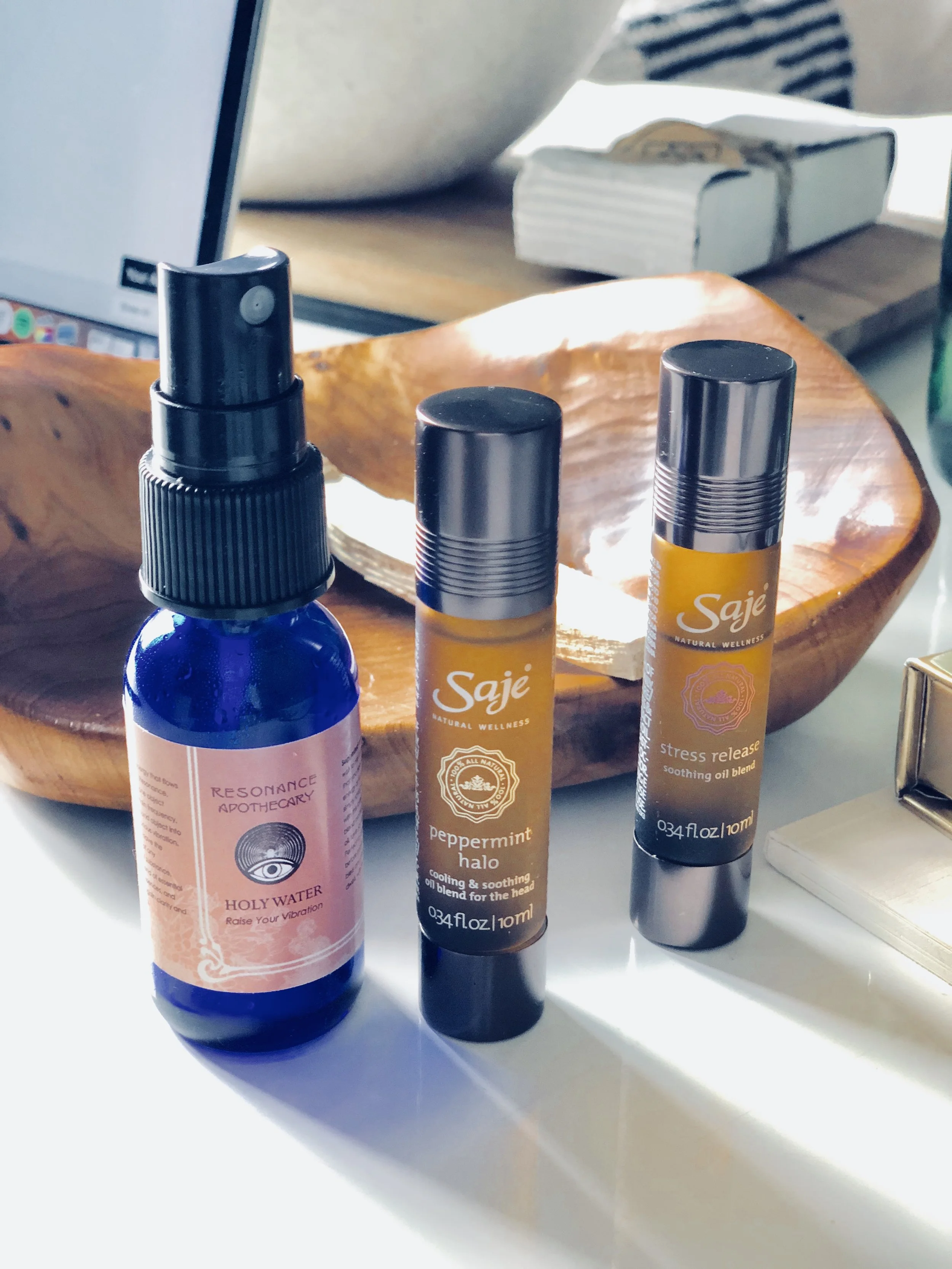 A few of my essentials. Resonance Apothecary's Holy water and a couple of my Saje's products. 