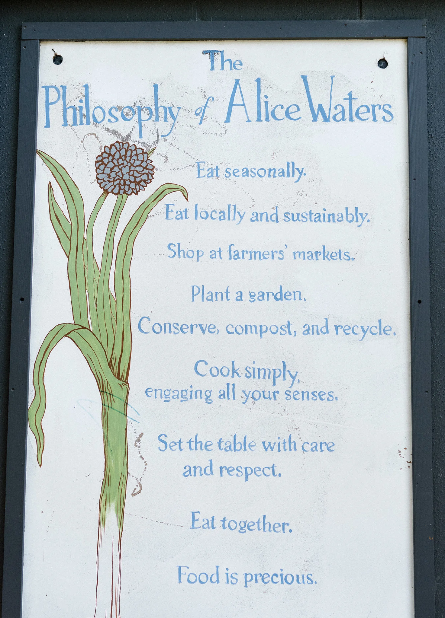 Alice Waters ’ philosophy on slow food and eating posted at the Edible Schoolyard at Martin Luther King Middle School in Berkeley. | Credit: Jason Henry