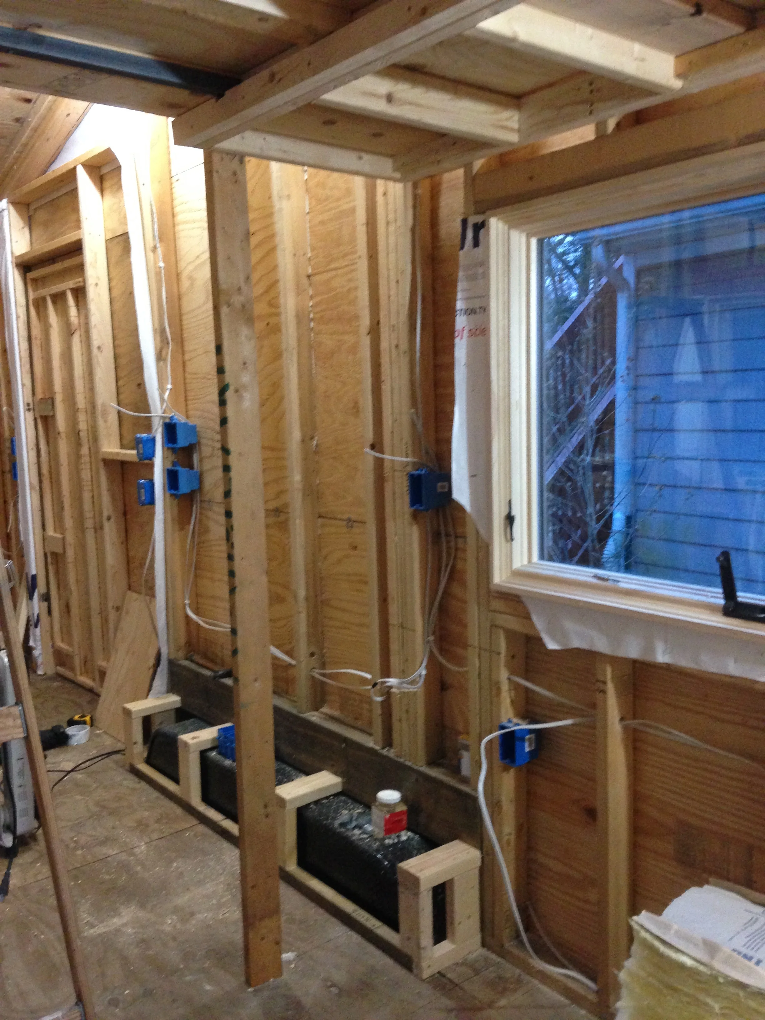Under the new loft framing. The vertical 2x4 is temporary - there will be stairs connected right here. Check out that wiring. Man, I got this. 