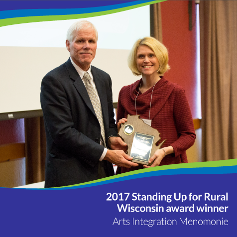 A.I.M. Executive Director, Dr. Tami Rae Weiss, and Michael Thompson , Deputy State Superintendent. Weiss accepts the award on behalf of UW-Stout. 