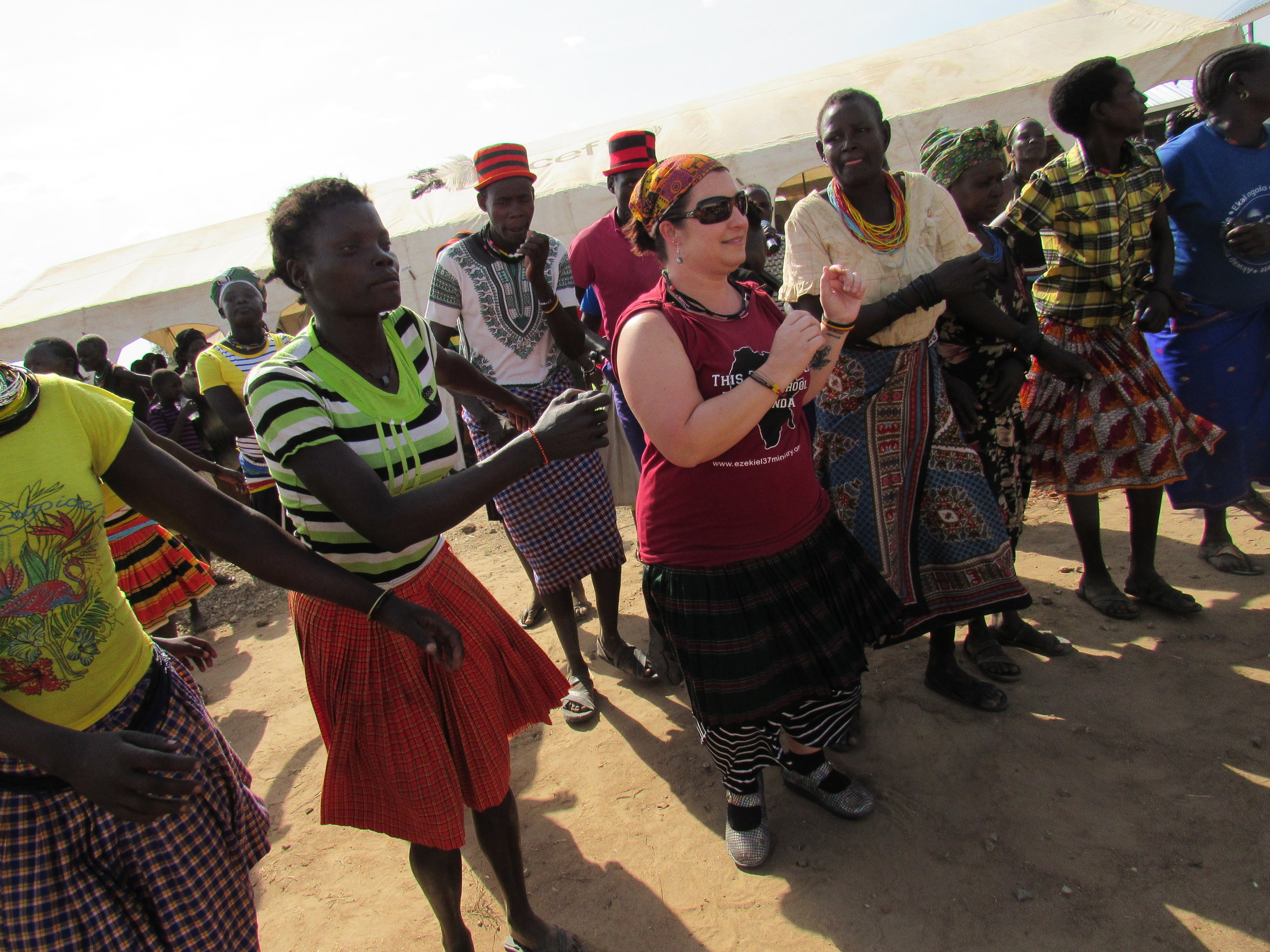 Amanda jumped in on the fun wearing her traditional Karamajong skirt that her sponsored student gave her.