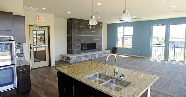  Among the amenities for Lumberyard 1505 renters is a community room with full kitchen and fireplace. There is a fitness room and a rooftop patio area attached to the community room. Photo by Mark Justesen