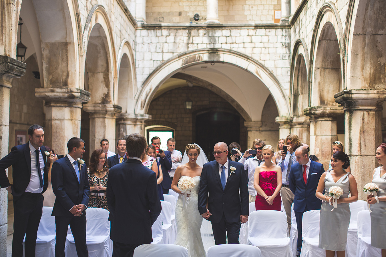 One of a set of images taken at this chic destination Wedding of Jenna & Nick. The stylish old town of Dubrovnik, Croatia.  The Congregation await.  Photography by Matt Porteous