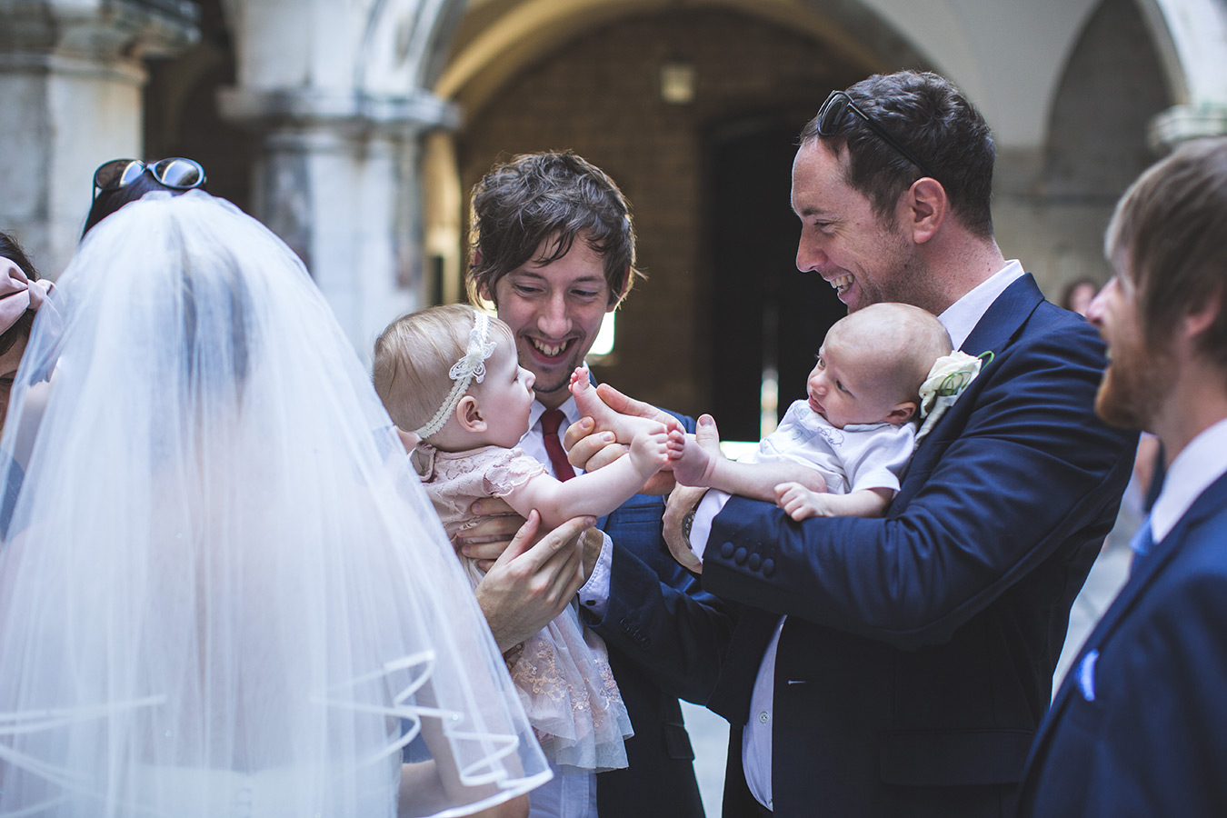 One of a set of images taken at this chic destination Wedding of Jenna & Nick. The stylish old town of Dubrovnik, Croatia.  Babies with the Bride and Groom.  Photography by Matt Porteous