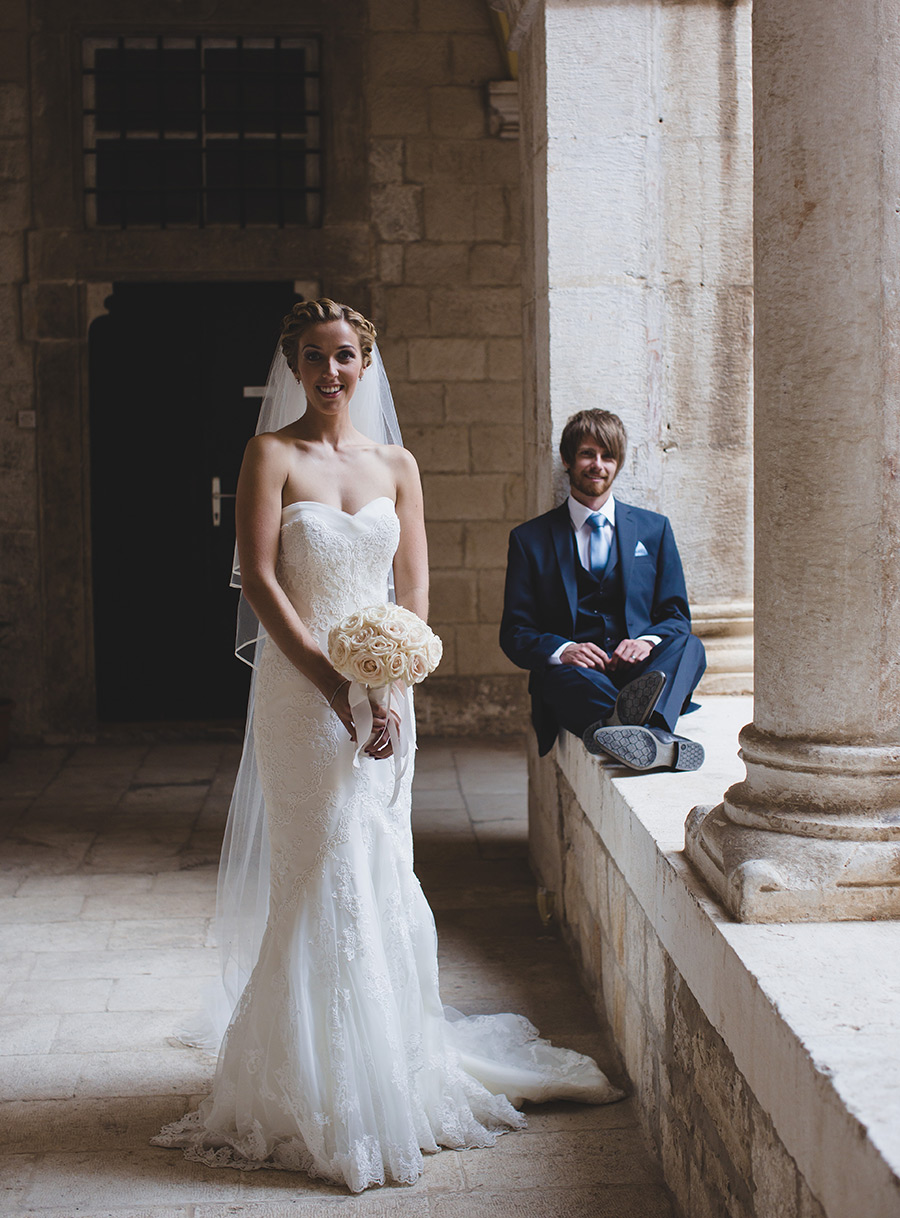 One of a set of images taken at this chic destination Wedding of Jenna & Nick. The stylish old town of Dubrovnik, Croatia.  The beautiful Bride poses in Ivory.  Photography by Matt Porteous