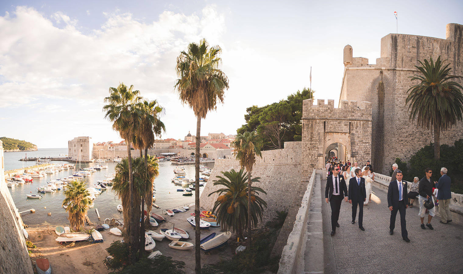 One of a set of images taken at this chic destination Wedding of Jenna & Nick. The stylish old town of Dubrovnik, Croatia.  The evening sun.  Photography by Matt Porteous