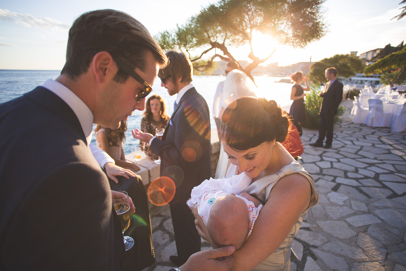 One of a set of images taken at this chic destination Wedding of Jenna & Nick. The stylish old town of Dubrovnik, Croatia.  The guests enjoy the warm evening.  Photography by Matt Porteous