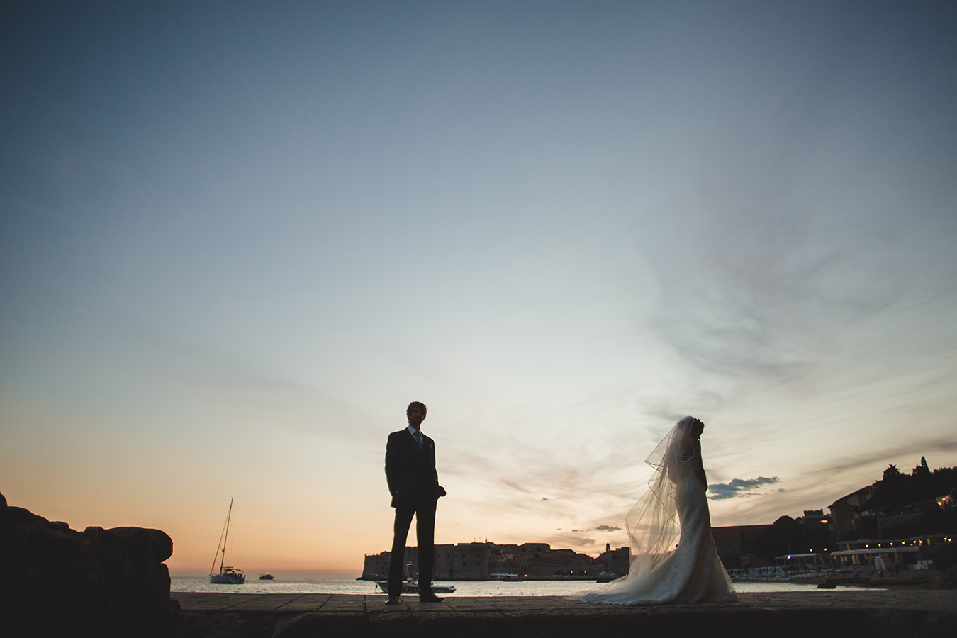 One of a set of images taken at this chic destination Wedding of Jenna & Nick. The stylish old town of Dubrovnik, Croatia.  The couple together in silhouette.  Photography by Matt Porteous