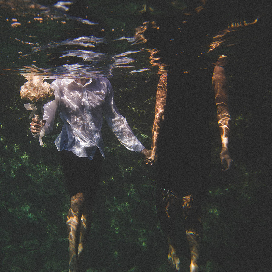 One of a set of images taken at this chic destination Wedding of Jenna & Nick. The stylish old town of Dubrovnik, Croatia.  Underwater image of the Bride and Groom.  photography by Matt Porteous