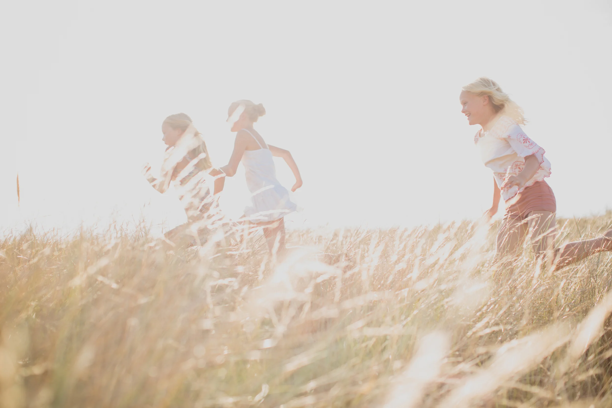 Children Running Through Grass