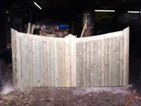 wooden light coloured fencing in workshop 