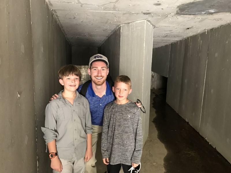 Jackson and Andy with Chad Duncan, our Impact Advisor and occasional babysitter, inside the collection unit (dam) at Blue Energy's first hydro project.